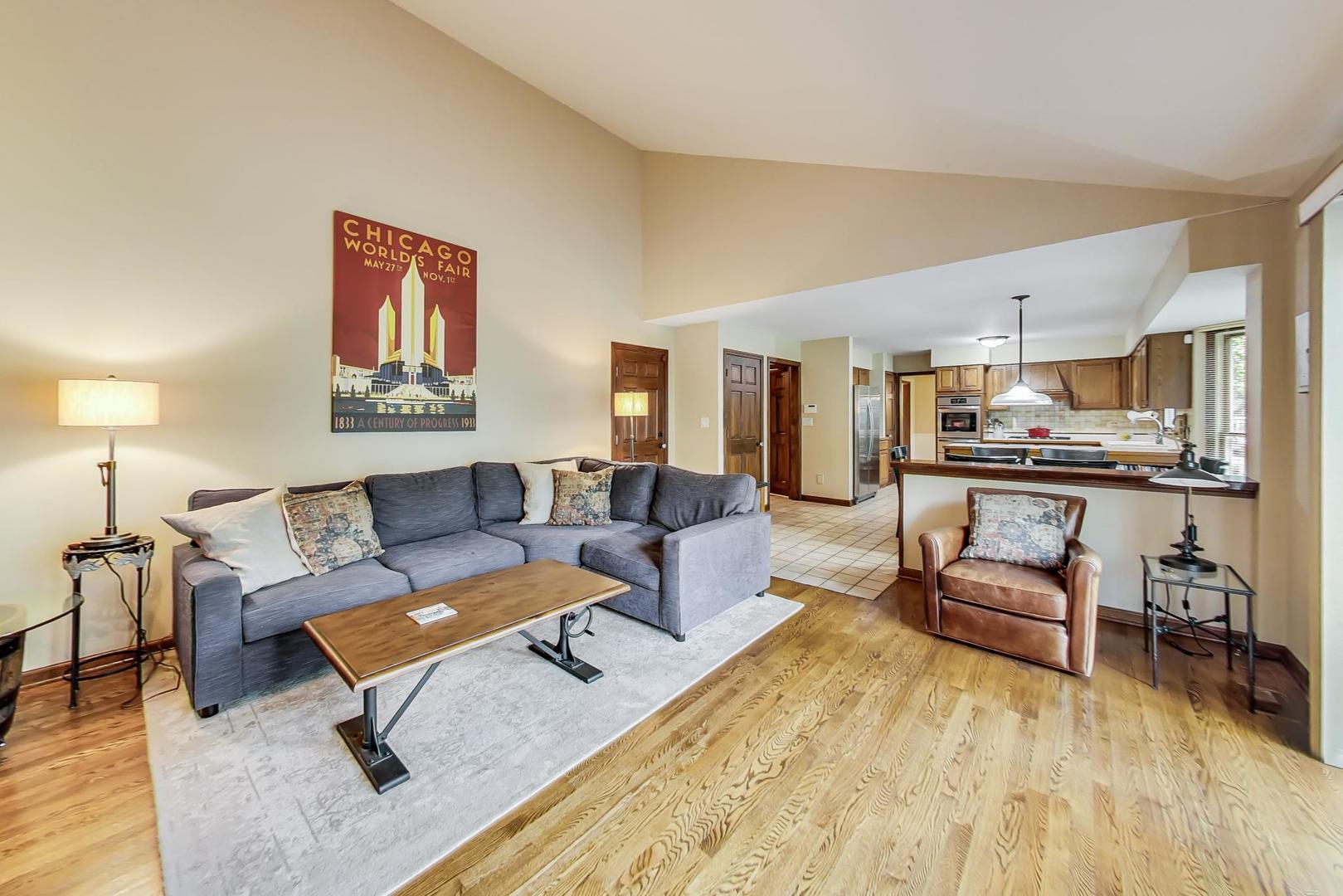 482 West 3rd Street Elmhurst, IL 60126 - Photo 17 of 39 a living room with furniture and kitchen view