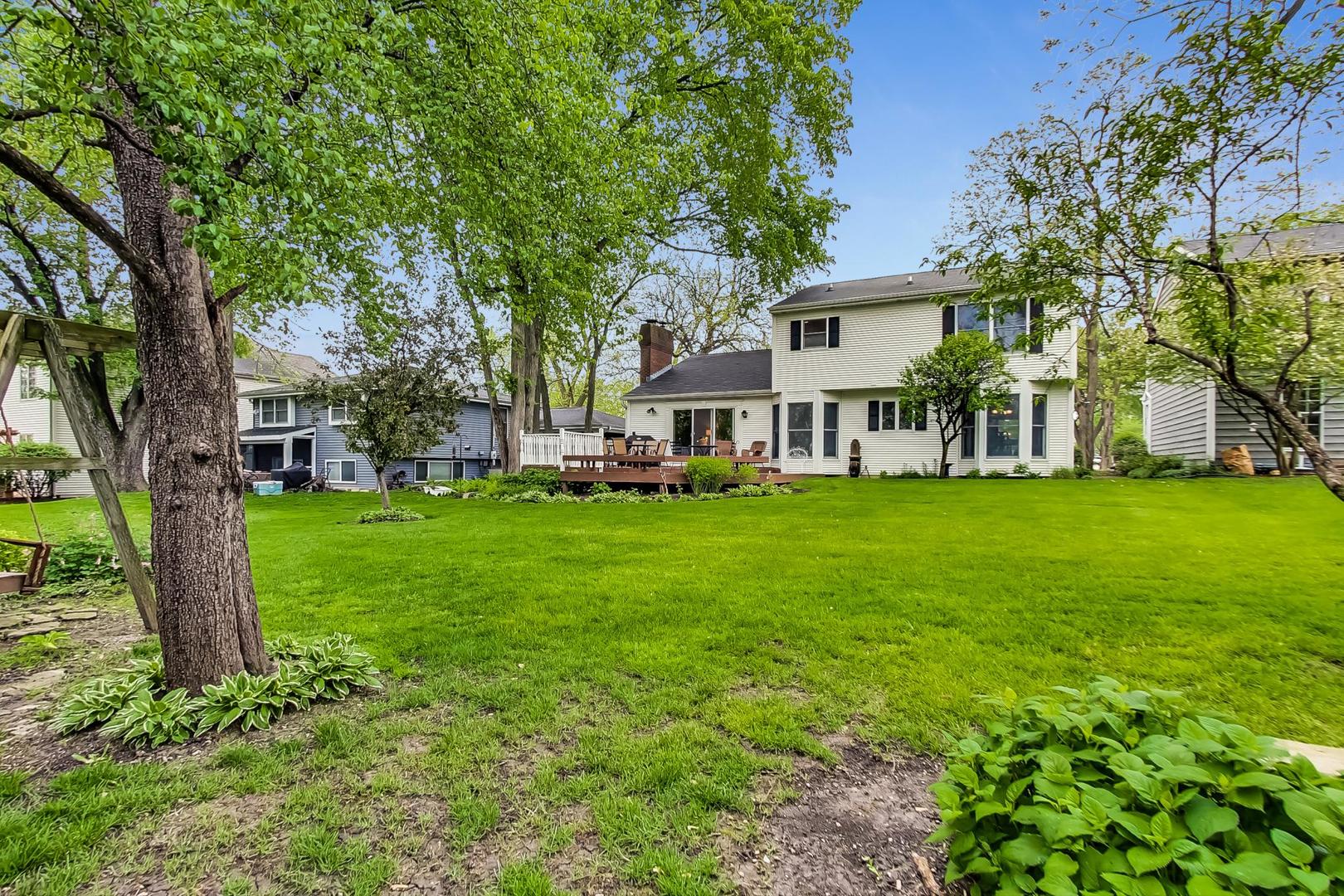 482 West 3rd Street Elmhurst, IL 60126 - Photo 36 of 39 a view of a house with a big yard and large trees