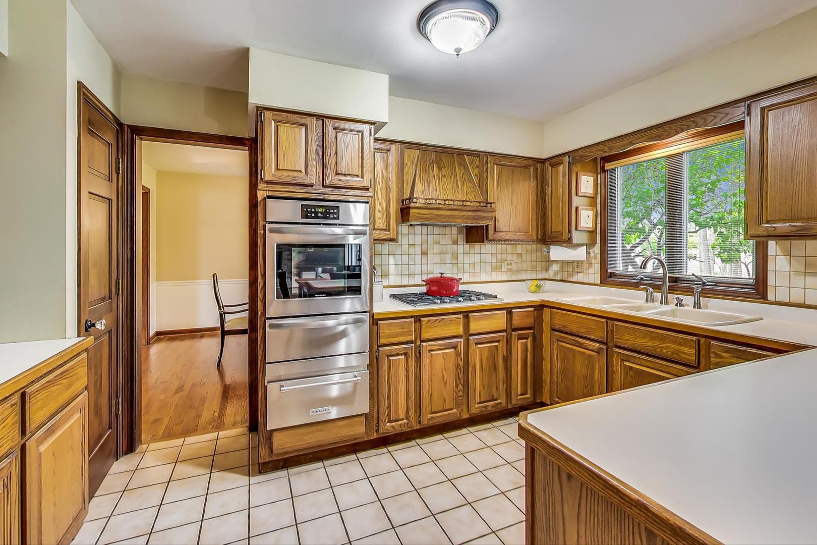 482 West 3rd Street Elmhurst, IL 60126 - Photo 9 of 39 a kitchen with stainless steel appliances a refrigerator sink and cabinets