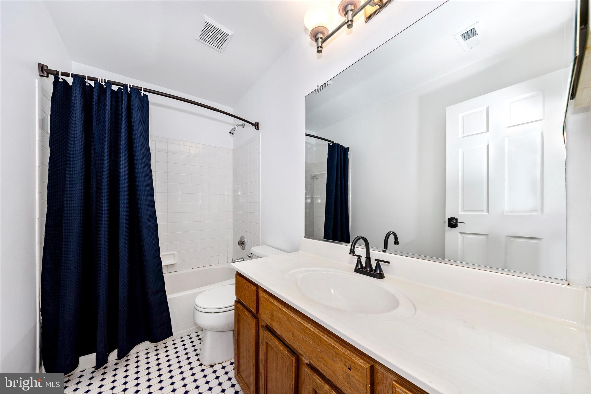 803 Apache Court Frederick, MD 21701 - Photo 27 of 46 a bathroom with a sink and a mirror