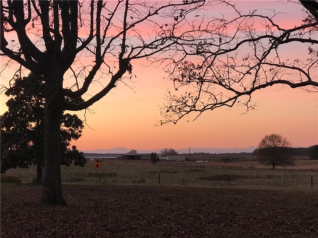 1014 Levis Smith Road Pendleton, SC 29670 - Photo 16 of 21 Witness the captivating sky as the day gracefully transitions to dusk, offering a serene backdrop.