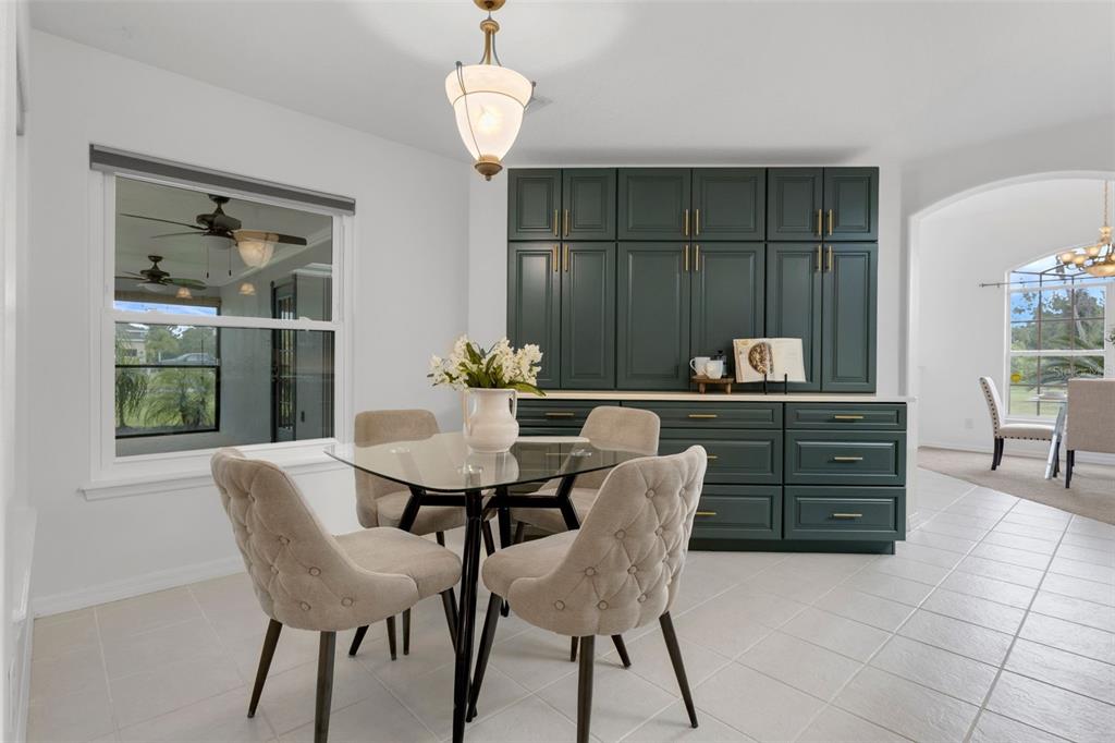 15038 Willow Lane Tavares, FL 32778 - Photo 11 of 37 a view of a dining room with furniture and chandelier