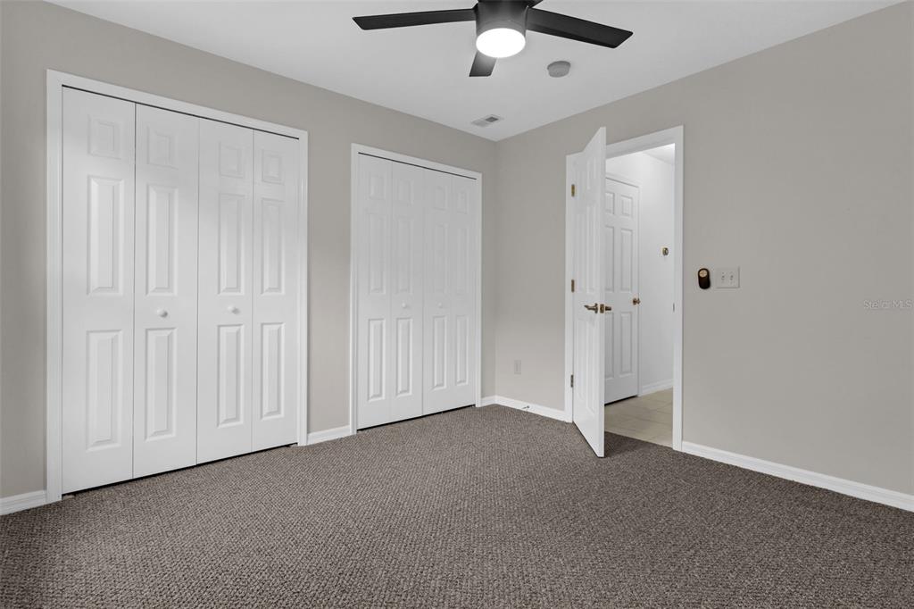 15038 Willow Lane Tavares, FL 32778 - Photo 22 of 37 an empty room with fan