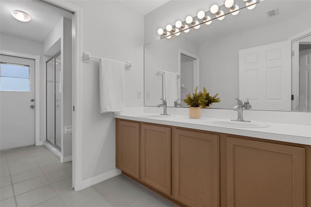 15038 Willow Lane Tavares, FL 32778 - Photo 24 of 37 a bathroom with a sink and a mirror