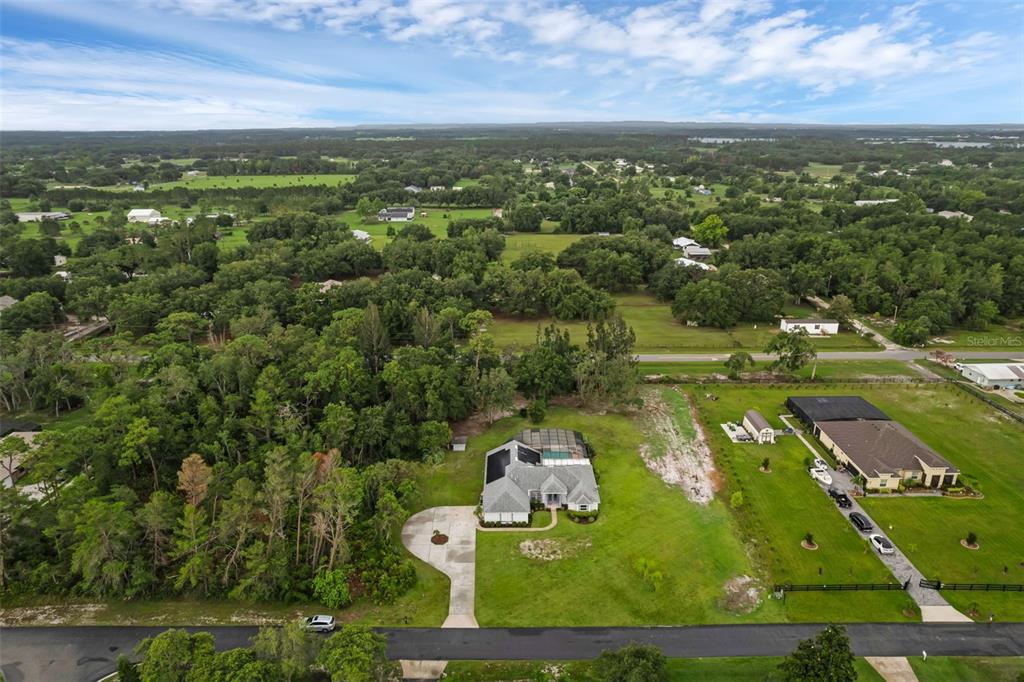 15038 Willow Lane Tavares, FL 32778 - Photo 33 of 37 an aerial view of lake residential house with outdoor space