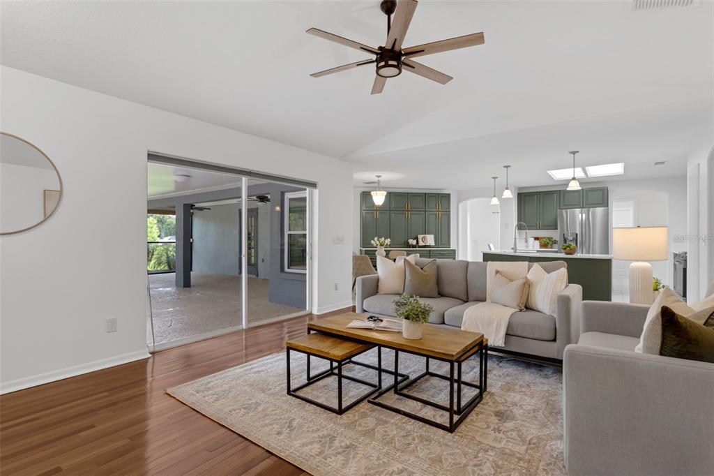 15038 Willow Lane Tavares, FL 32778 - Photo 9 of 37 a living room with furniture and a view of kitchen