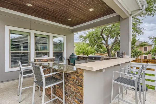 a table and chairs in front of a house