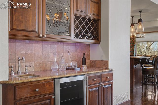 3985 Broadmoor Valley Road Colorado Springs, CO 80906 - Photo 15 of 50 Main Level Wet Bar