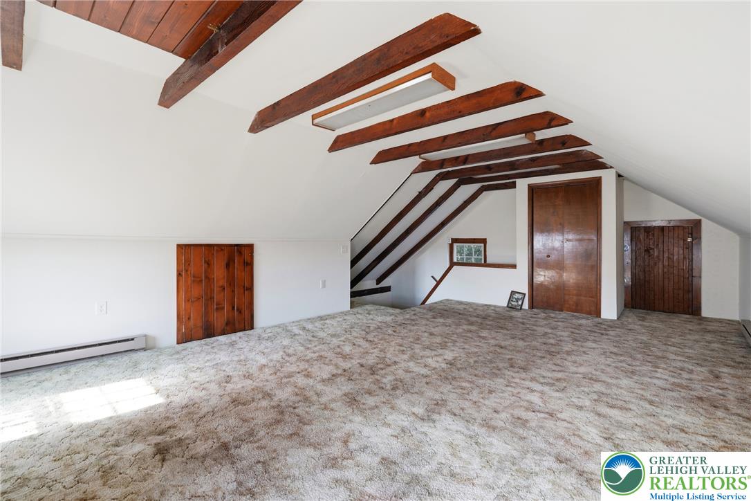 4682 Steuben Road Bethlehem, PA 18020 - Photo 41 of 79 Exposed beams complement the peaked ceilings in this versatile attic space.