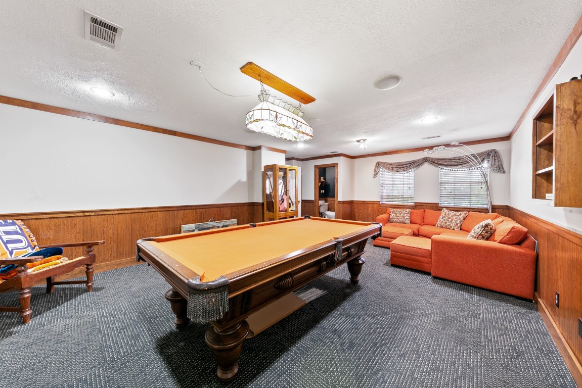 13915 Springmint Drive Cypress, TX 77429 - Photo 26 of 43 Spacious game room with durable carpet, wood trim accents, and plenty of room for recreation and entertaining