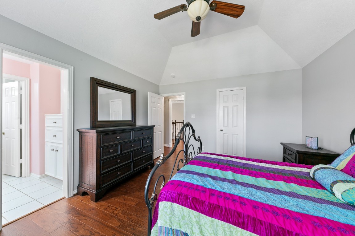 13915 Springmint Drive Cypress, TX 77429 - Photo 29 of 43 a room with a bed and wooden floor