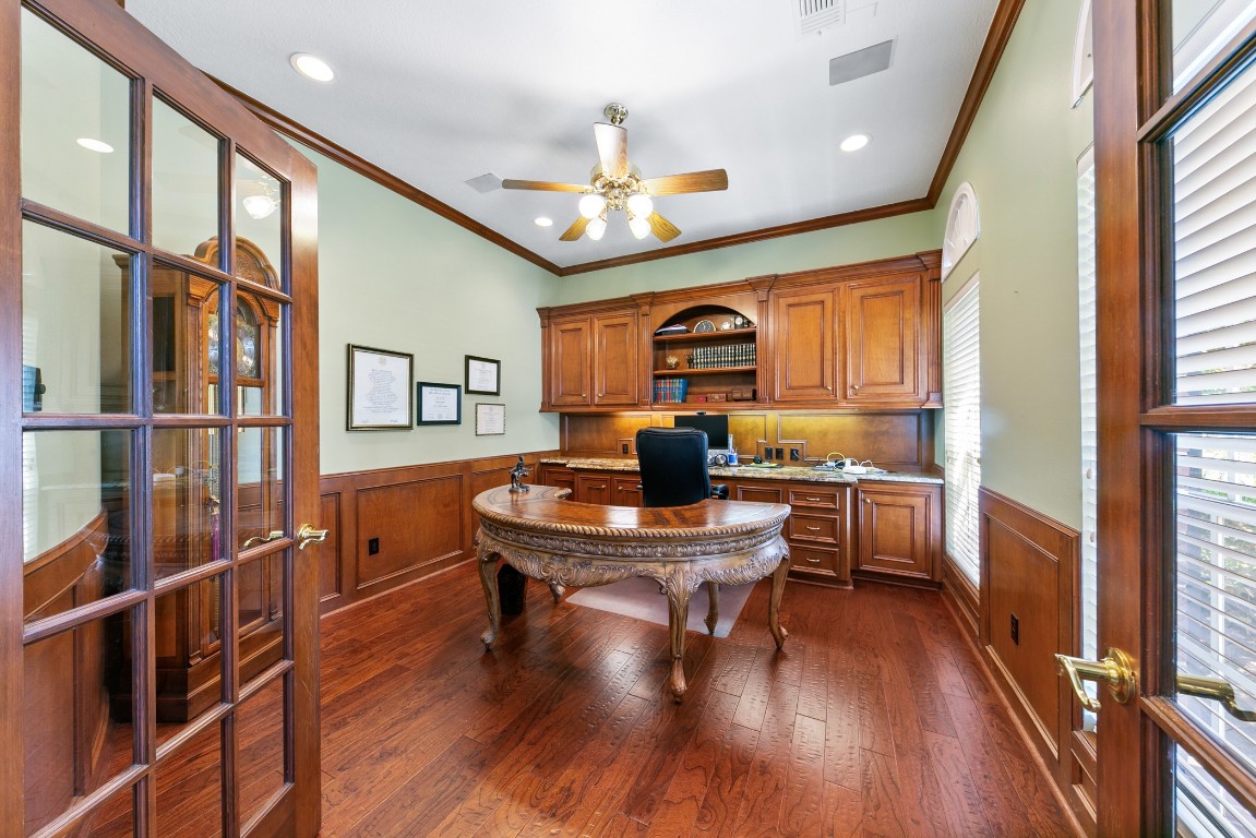 13915 Springmint Drive Cypress, TX 77429 - Photo 6 of 43 Private study just off the entry, featuring rich wood trim, custom built-in shelving, and elegant wainscoting for a warm yet sophisticated feel