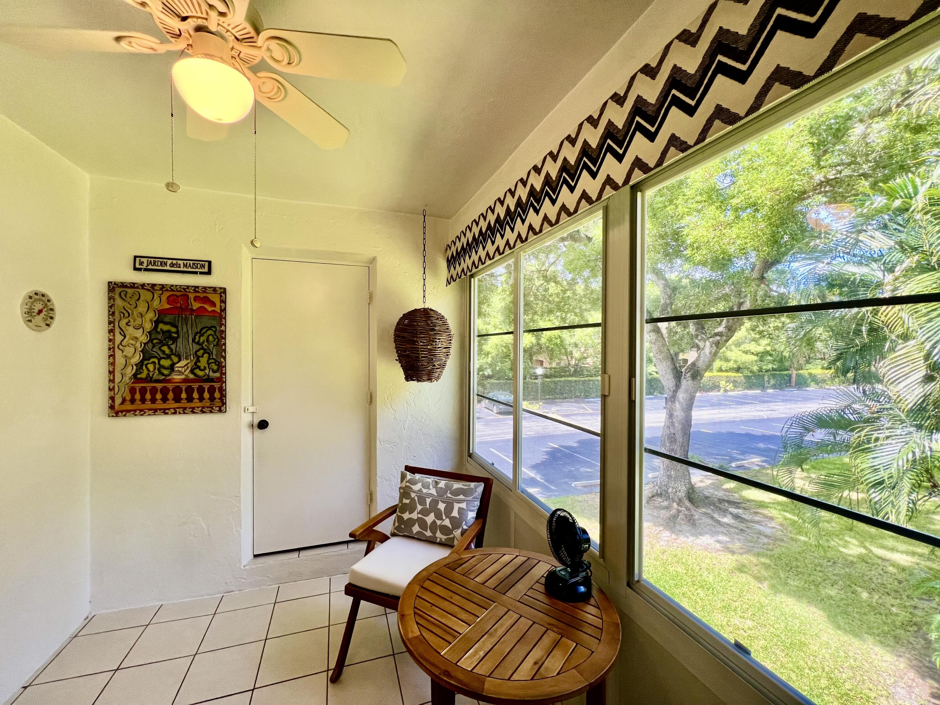 5640 Southwest 3rd Place, Unit 217 Margate, FL 33068 - Photo 14 of 32 a living room with furniture and a large window