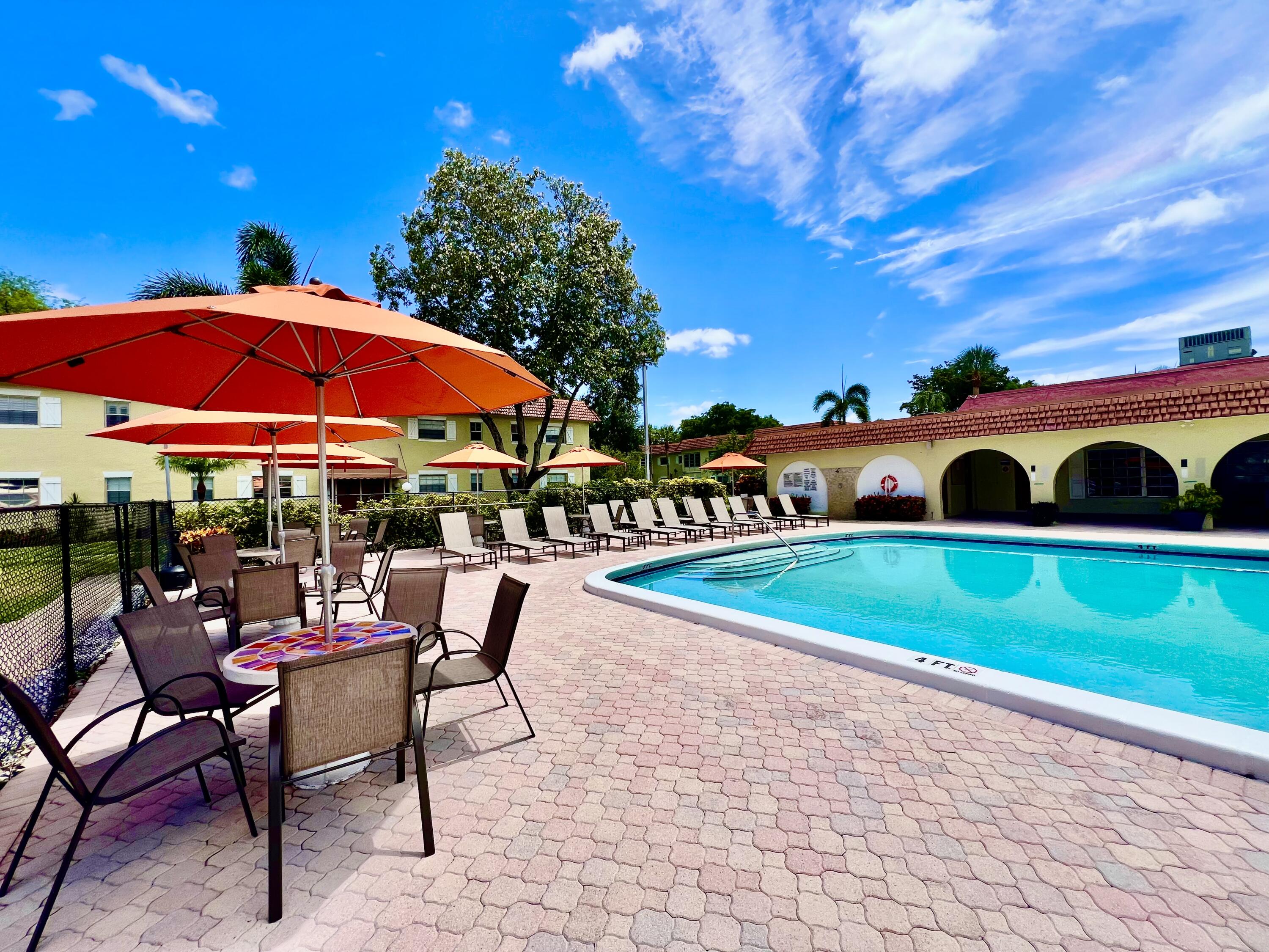 5640 Southwest 3rd Place, Unit 217 Margate, FL 33068 - Photo 22 of 32 a view of a swimming pool with sitting area