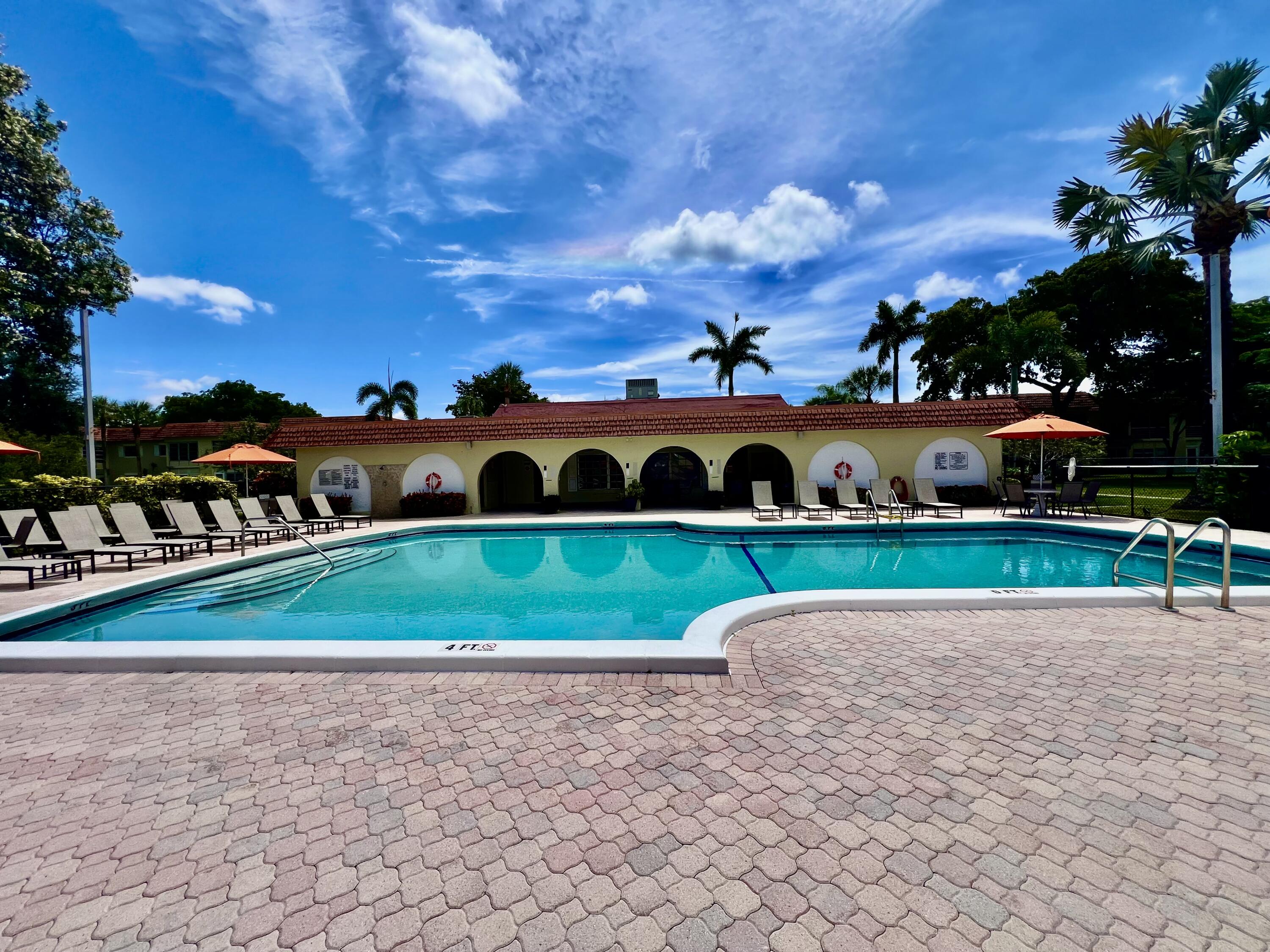 5640 Southwest 3rd Place, Unit 217 Margate, FL 33068 - Photo 23 of 32 a view of a golf course with a bench