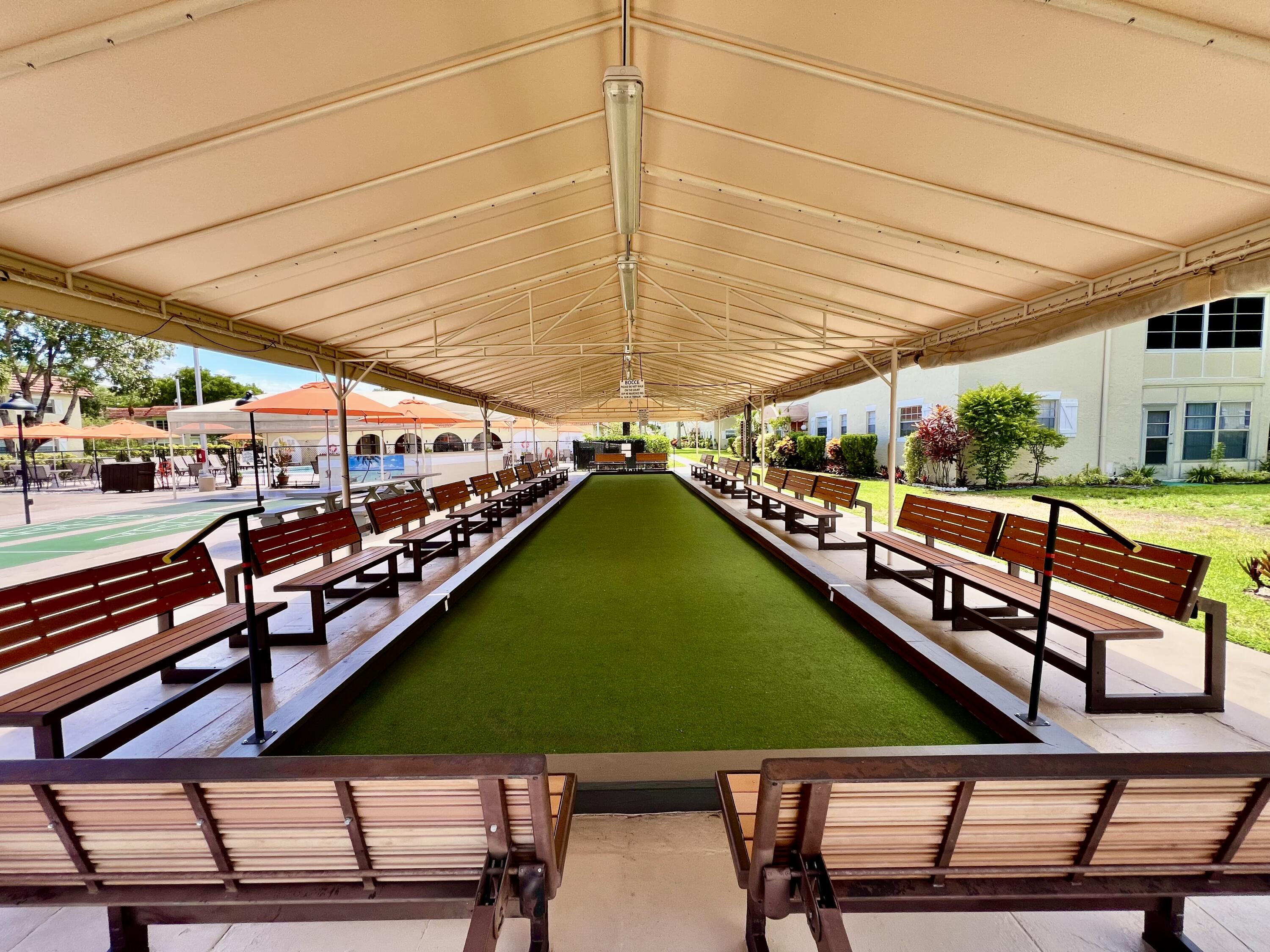 5640 Southwest 3rd Place, Unit 217 Margate, FL 33068 - Photo 26 of 32 a view of a swimming pool with a patio