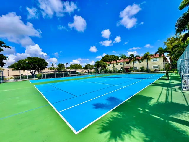 a view of an outdoor space and basketball court