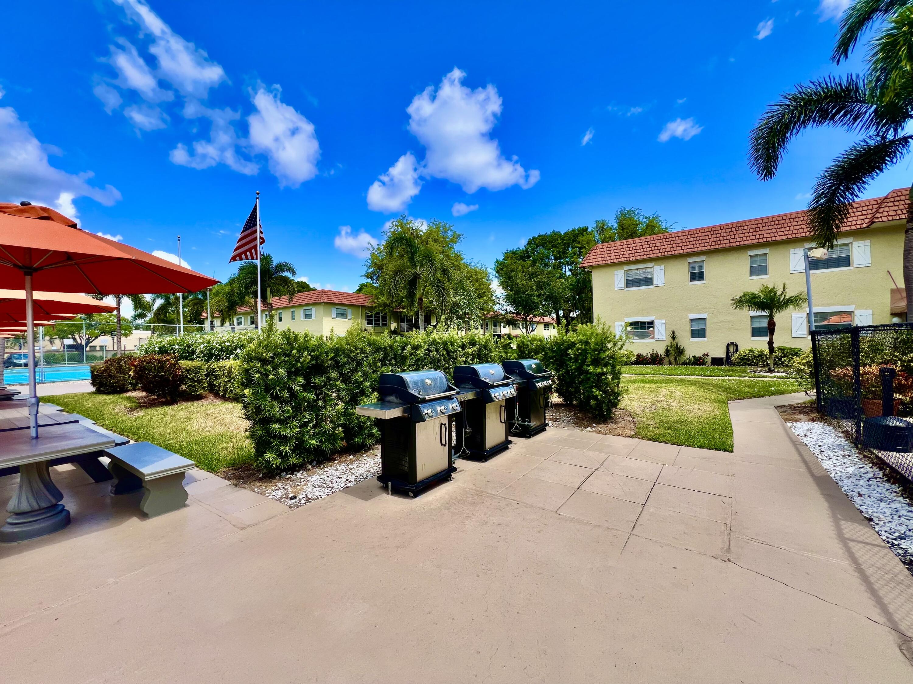 5640 Southwest 3rd Place, Unit 217 Margate, FL 33068 - Photo 30 of 32 a view of an house with backyard and sitting area