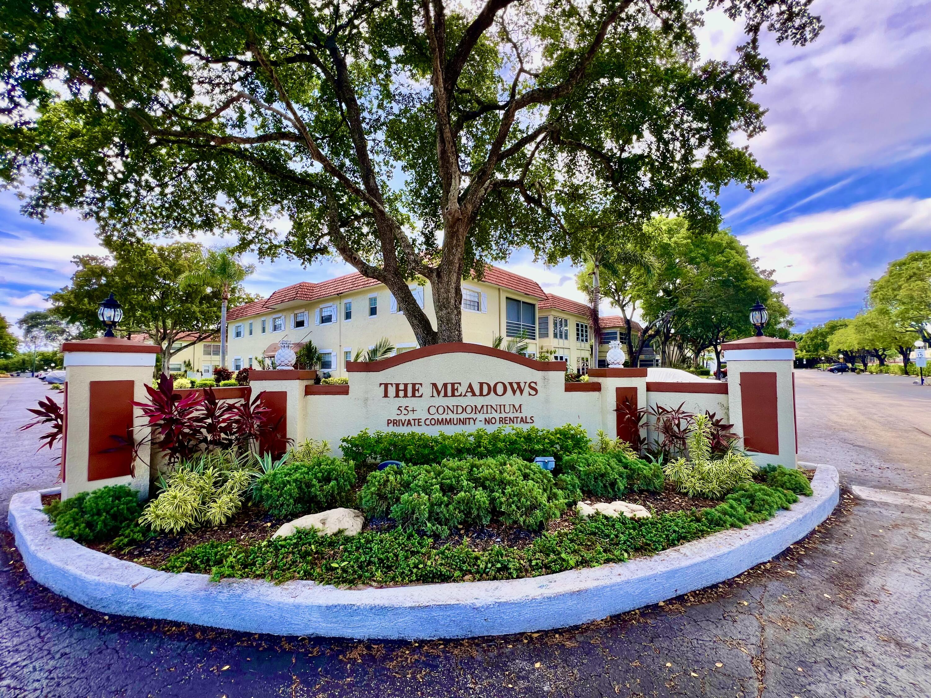 5640 Southwest 3rd Place, Unit 217 Margate, FL 33068 - Photo 32 of 32 a view of a street with a house in the background