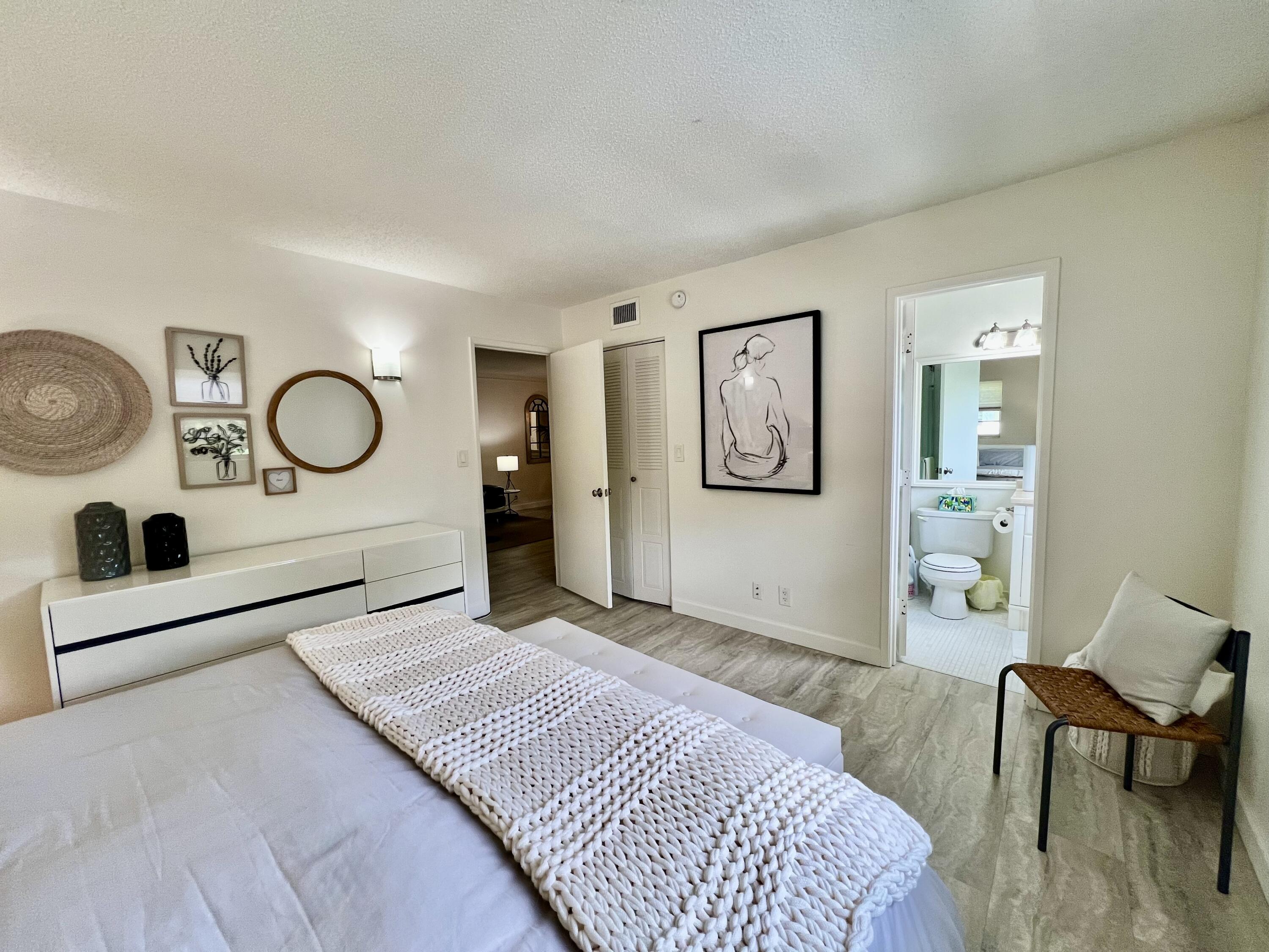 5640 Southwest 3rd Place, Unit 217 Margate, FL 33068 - Photo 5 of 32 a bedroom with a bed and a dresser