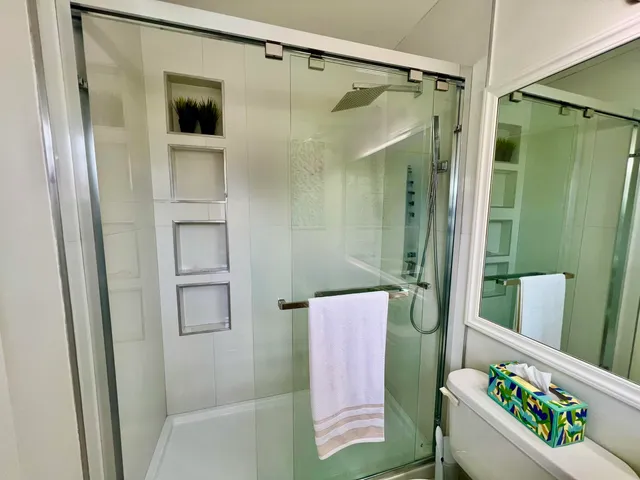 a bathroom with a shower curtain and a sink