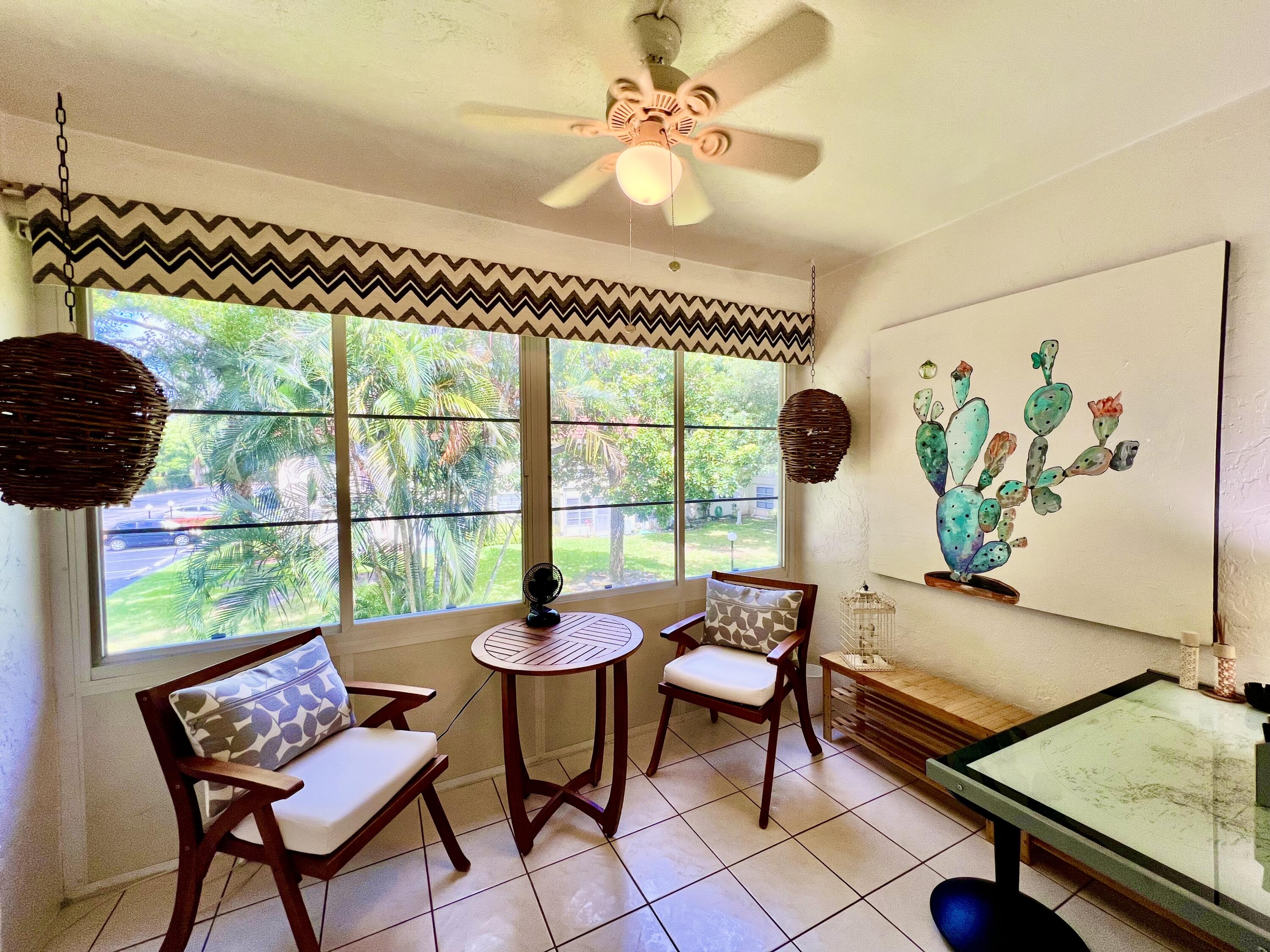 5640 Southwest 3rd Place, Unit 217 Margate, FL 33068 - Photo 8 of 32 a living room with furniture and a window