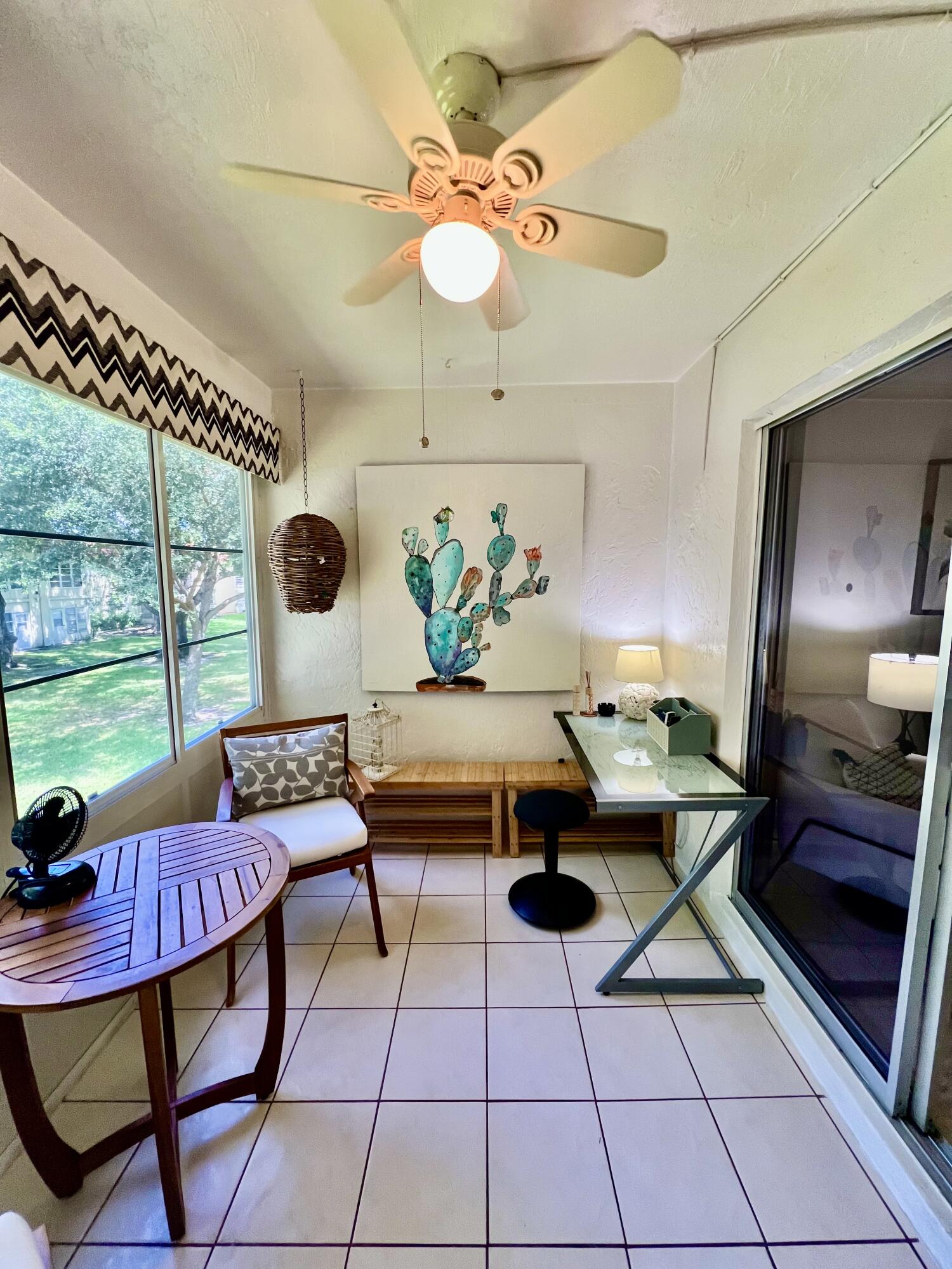 5640 Southwest 3rd Place, Unit 217 Margate, FL 33068 - Photo 9 of 32 a living room with furniture and a floor to ceiling window