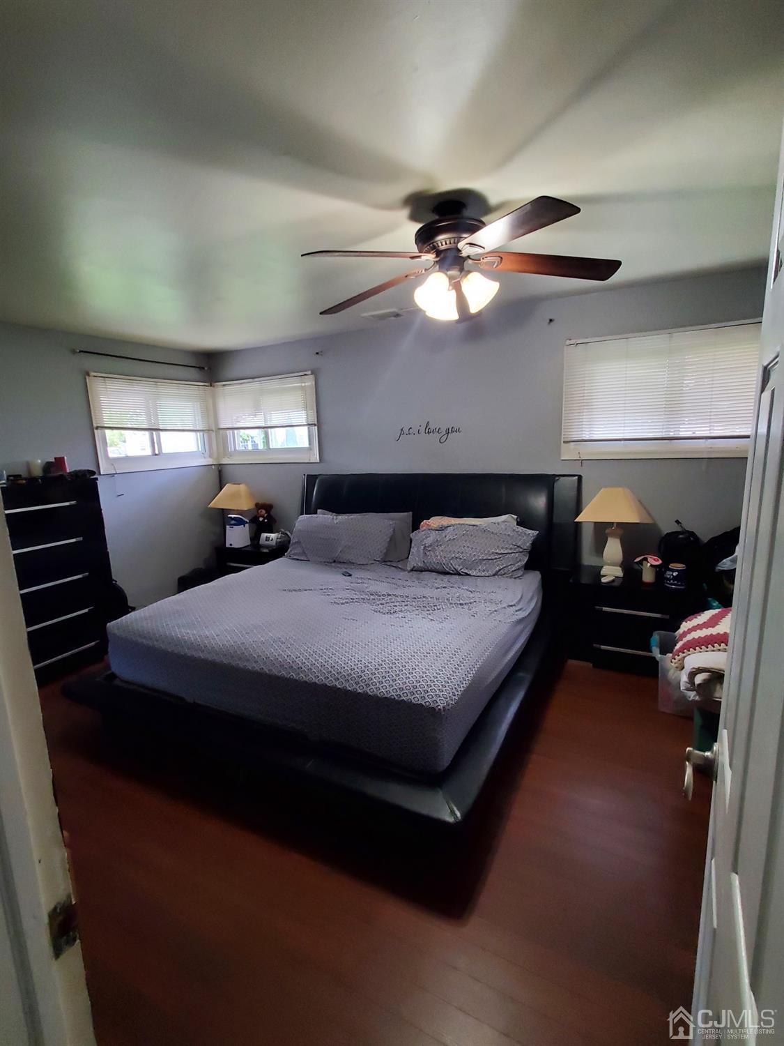1 Altamont Road Edison, NJ 08817 - Photo 8 of 14 a spacious bedroom with a bed a dresser and a chandelier