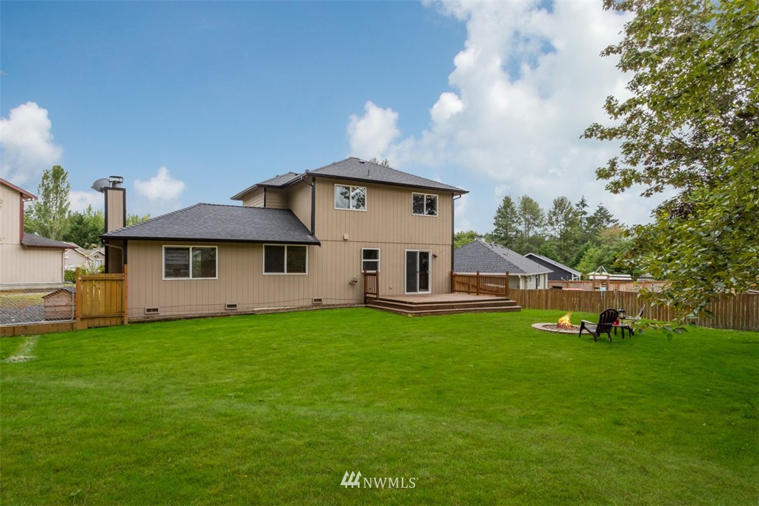 1229 221st Place Southwest Bothell, WA 98021 - Photo 22 of 25 a view of a house with a yard
