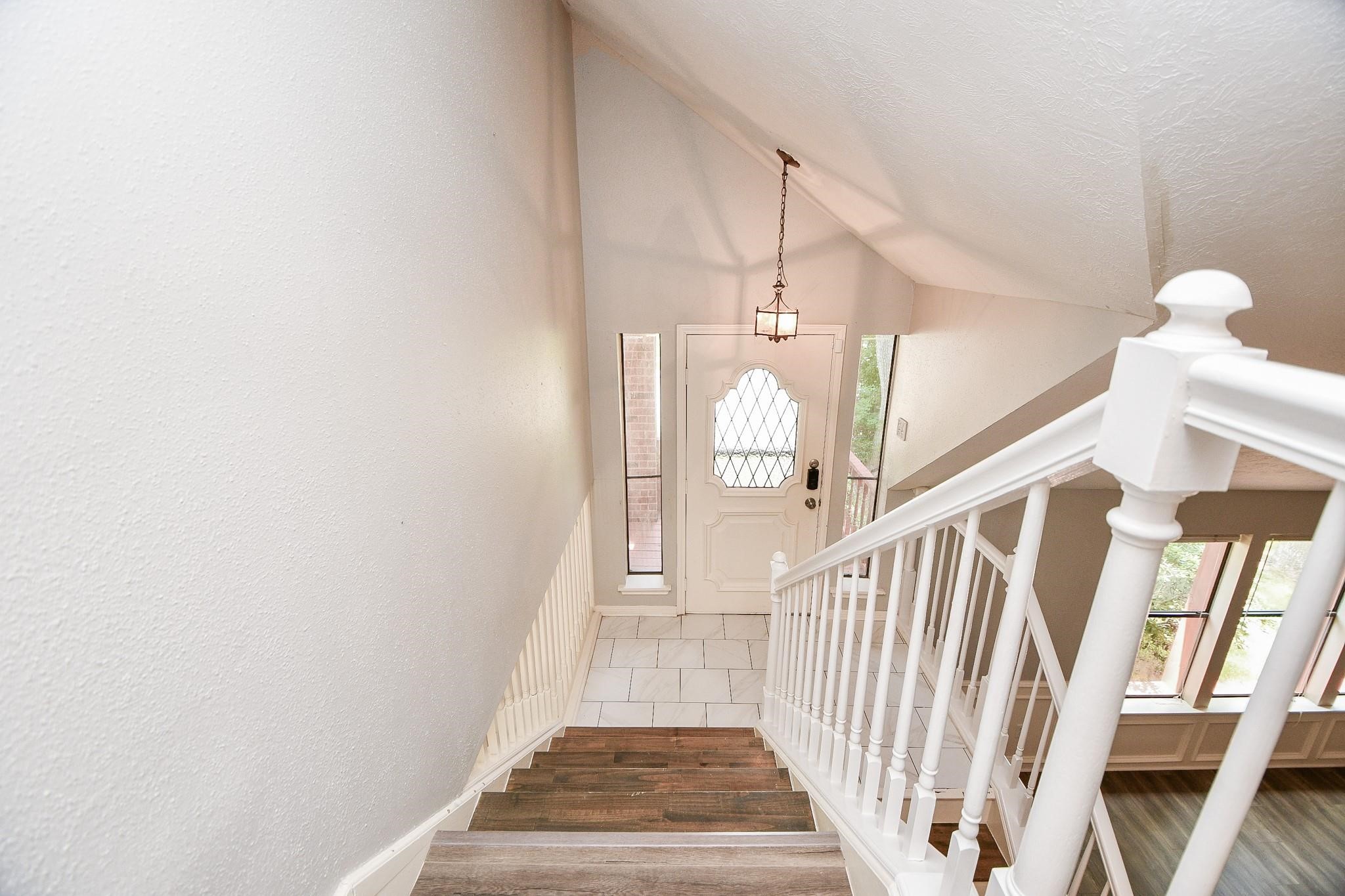 2331 Wren Meadow Road Richmond, TX 77406 - Photo 22 of 37 View from the second floor down to the front door, showing more of the split level design.