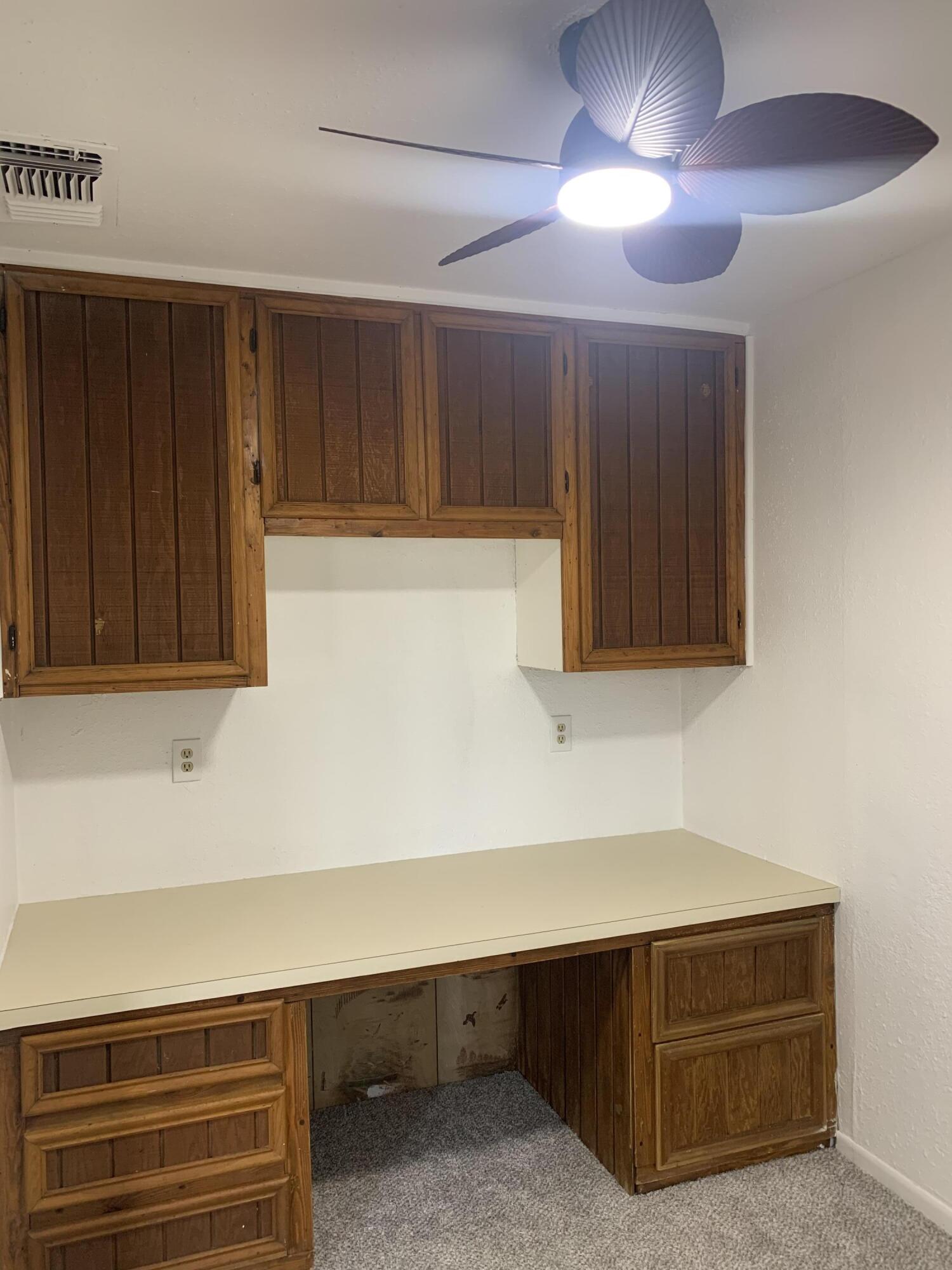 750 South 13th Street Slaton, TX 79364 - Photo 6 of 13 a room with furniture and a cabinet