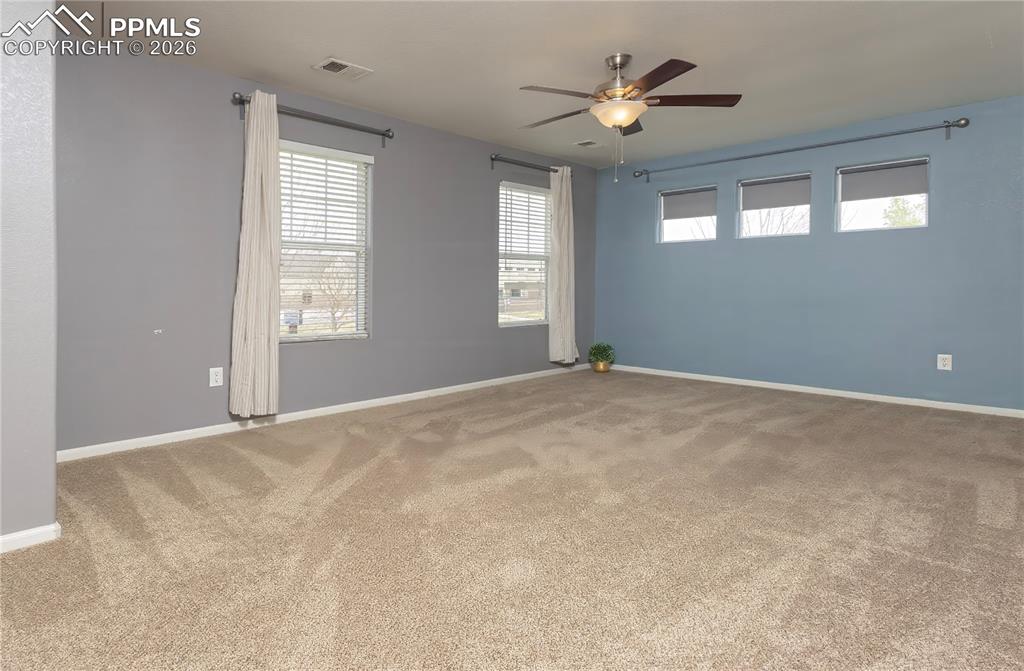 4815 Harrier Ridge Drive Colorado Springs, CO 80916 - Photo 25 of 33 Spare room with ceiling fan and light carpet