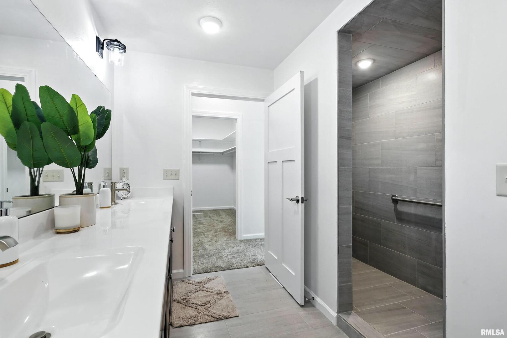 3303 Valley Drive Geneseo, IL 61254 - Photo 21 of 50 a bathroom with a shower and a sink