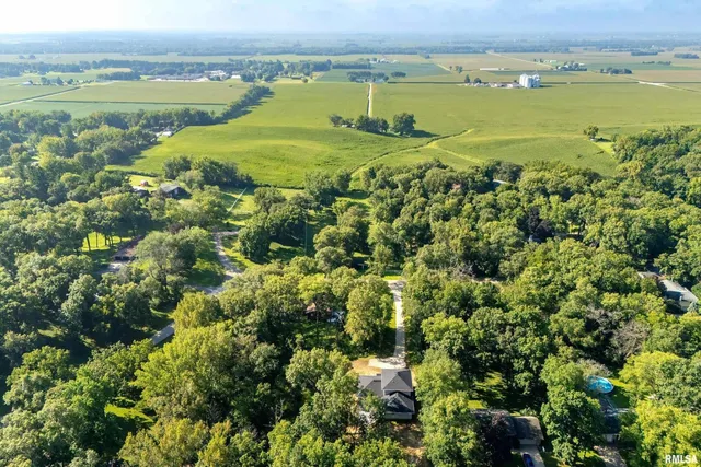 a view of a field with an ocean view