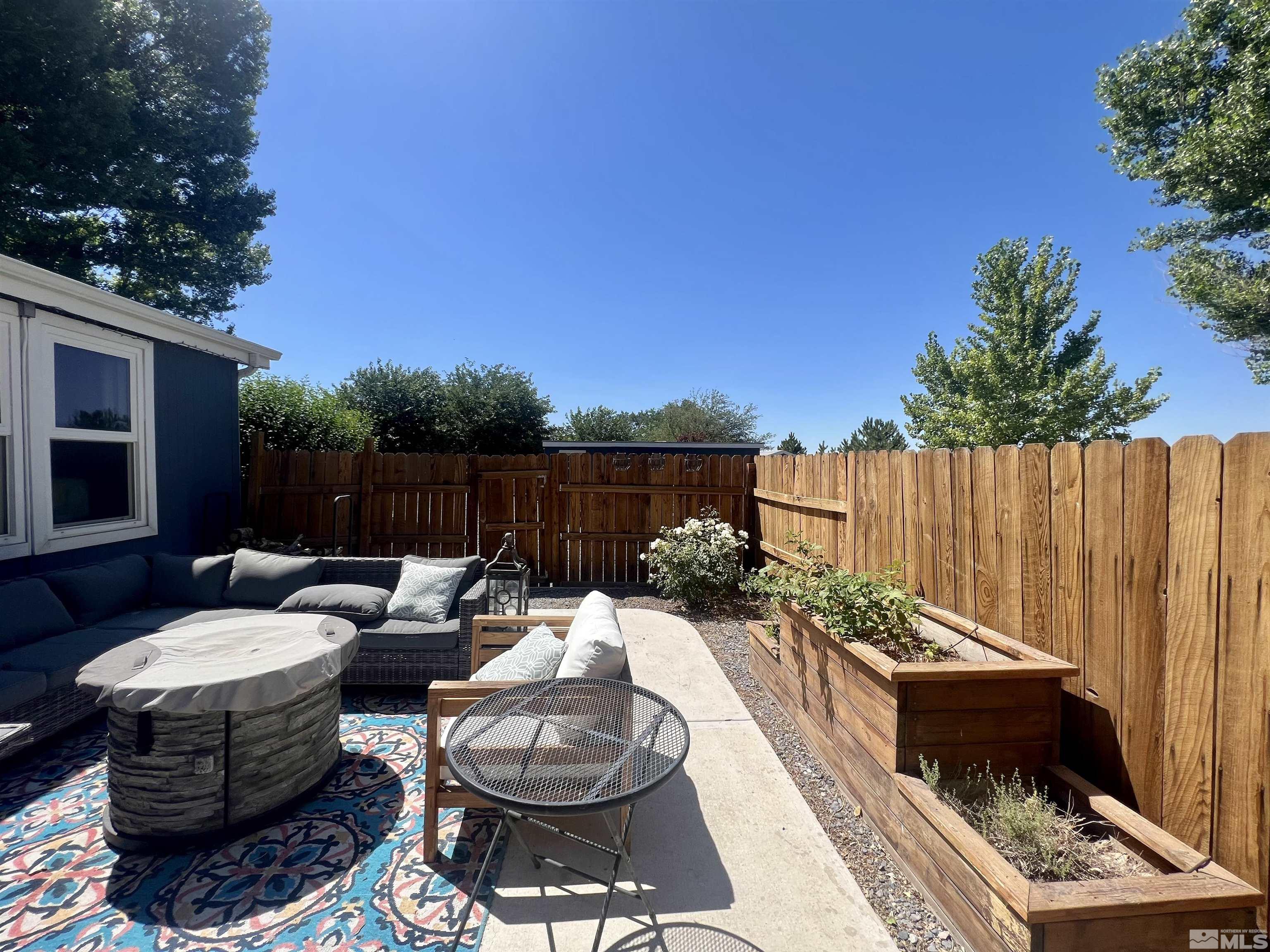 1405 South Meridian Road Lovelock, NV 89419 - Photo 15 of 39 a view of a backyard with furniture and a garden