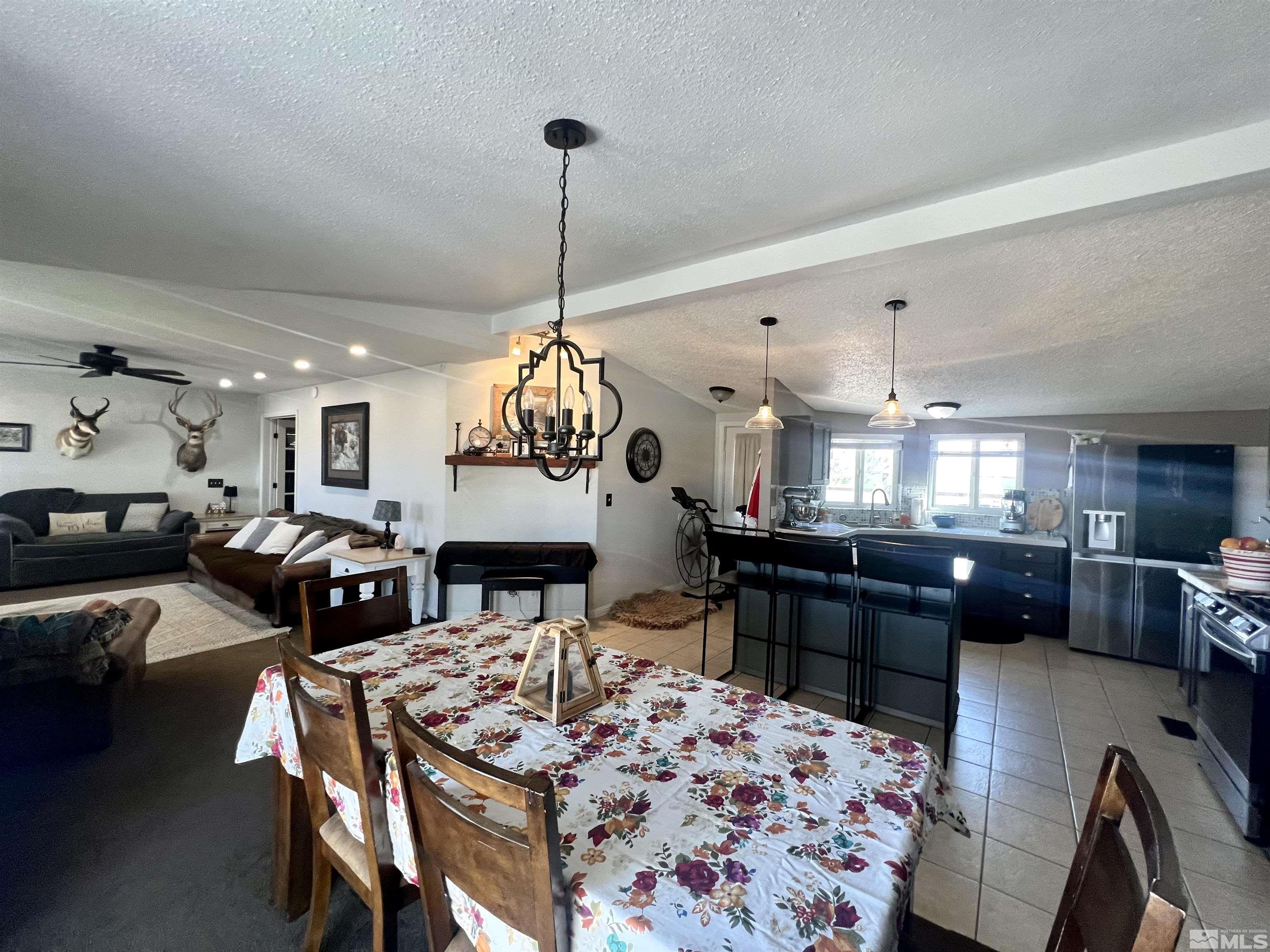 1405 South Meridian Road Lovelock, NV 89419 - Photo 19 of 39 a large kitchen with a table and chairs