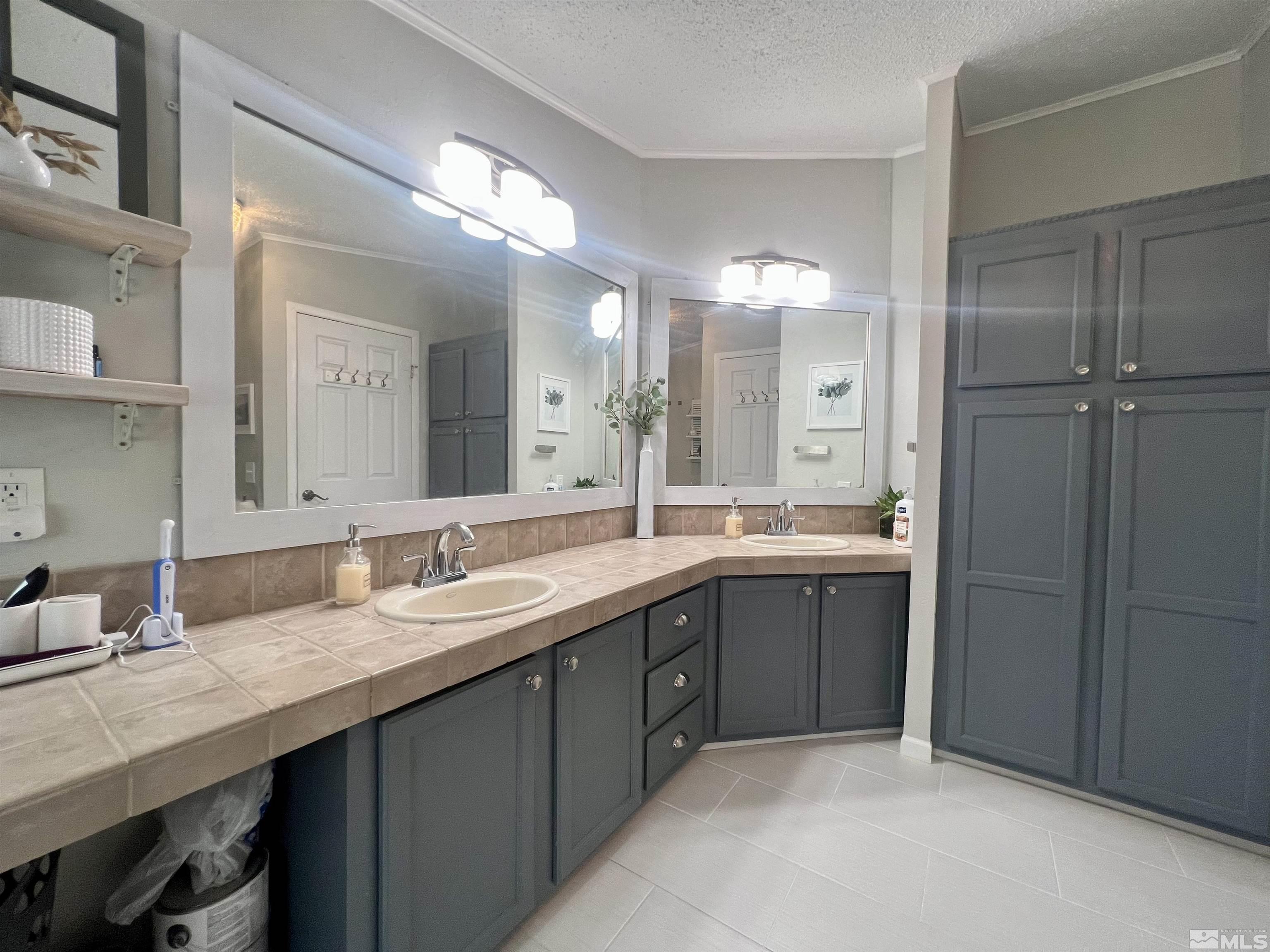 1405 South Meridian Road Lovelock, NV 89419 - Photo 21 of 39 a bathroom with a granite countertop sink double and mirror