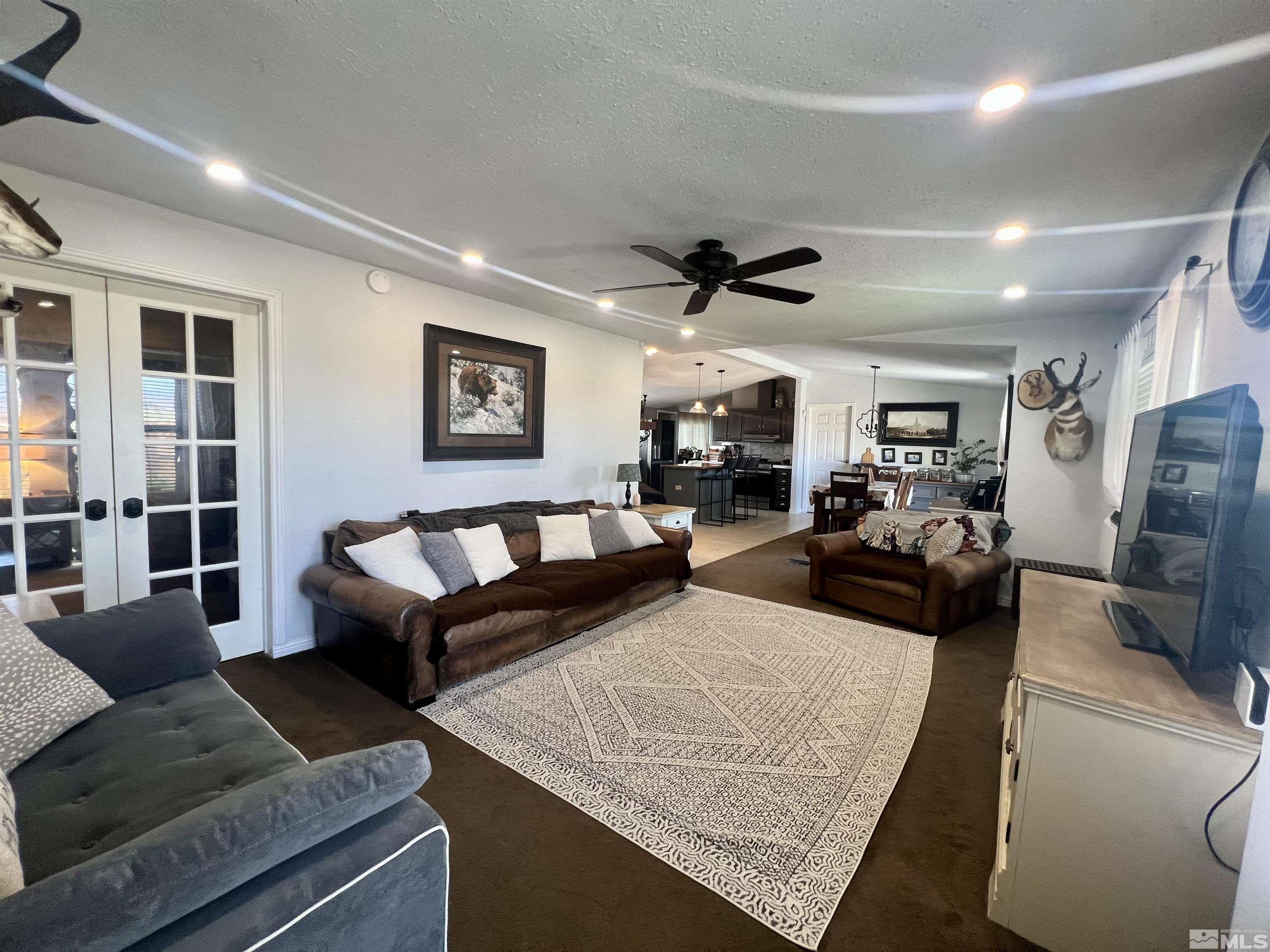 1405 South Meridian Road Lovelock, NV 89419 - Photo 25 of 39 a living room with furniture and a flat screen tv