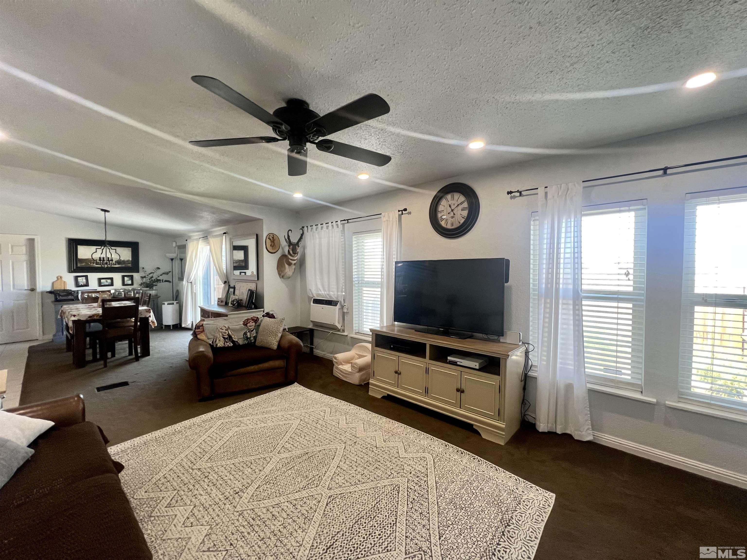 1405 South Meridian Road Lovelock, NV 89419 - Photo 27 of 39 a living room with furniture and a flat screen tv