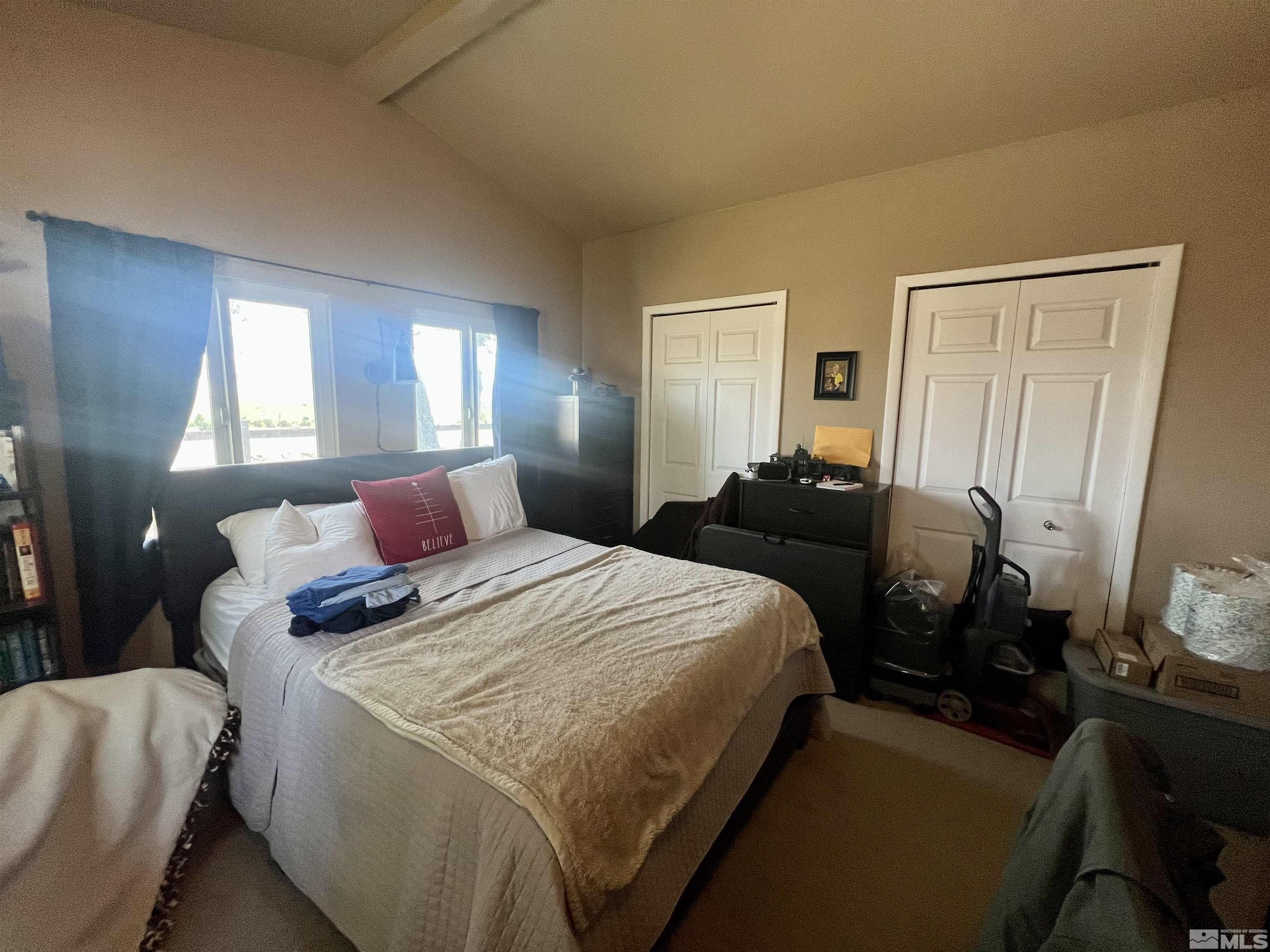 1405 South Meridian Road Lovelock, NV 89419 - Photo 38 of 39 a bedroom with a bed and wooden floor