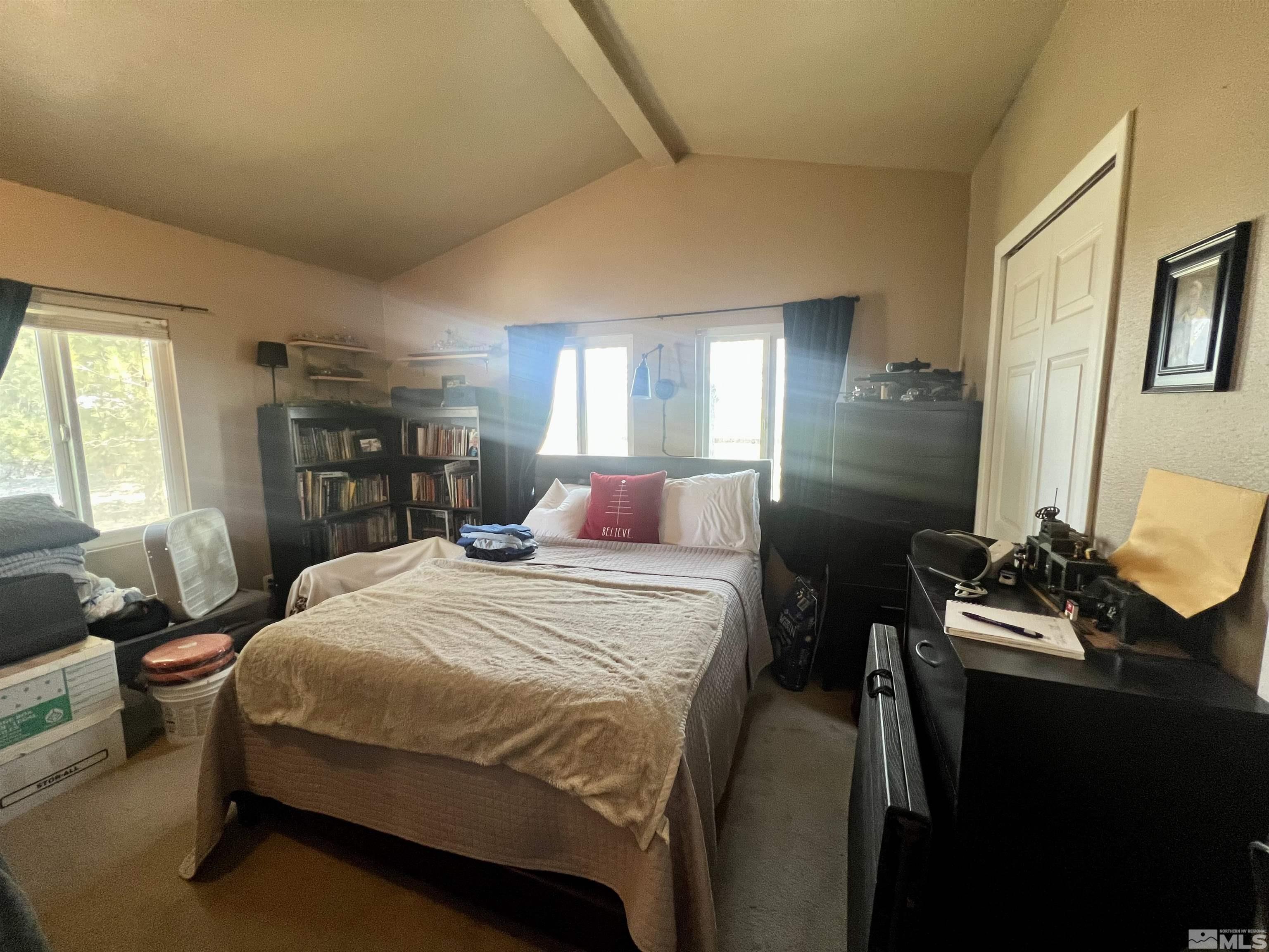 1405 South Meridian Road Lovelock, NV 89419 - Photo 39 of 39 a bedroom with a bed and a dresser next to a window