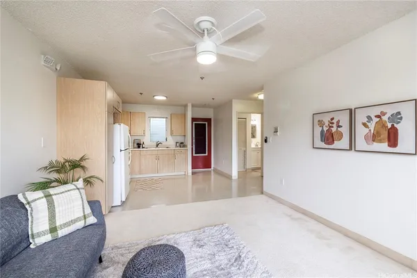 a kitchen with a white cabinets and white appliances
