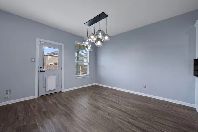 a view of livingroom with hardwood floor and window