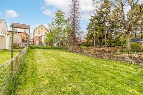 a view of a swimming pool with an outdoor space and seating area