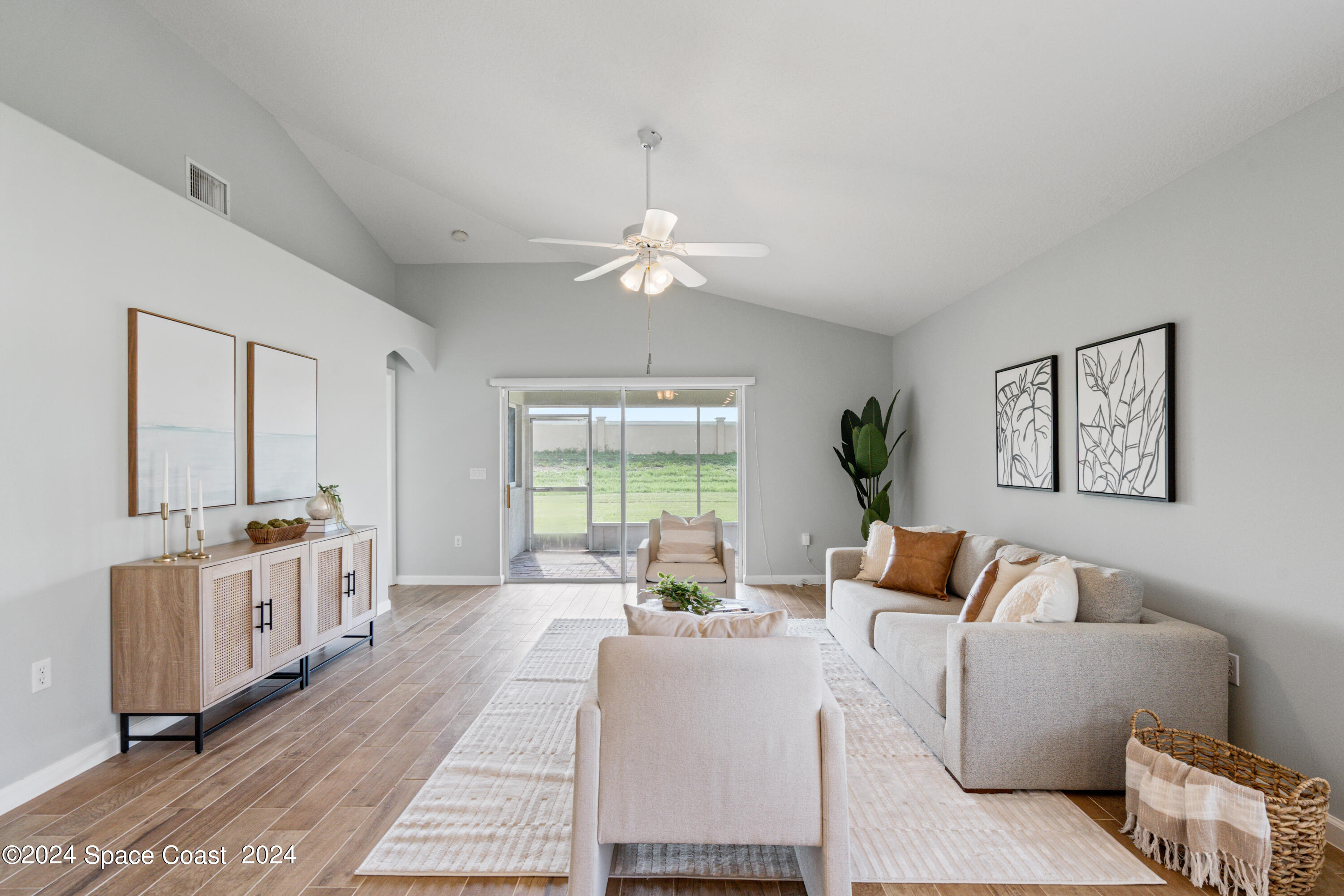 4220 Chardonnay Drive Rockledge, FL 32955 - Photo 11 of 51 a living room with furniture and a large window