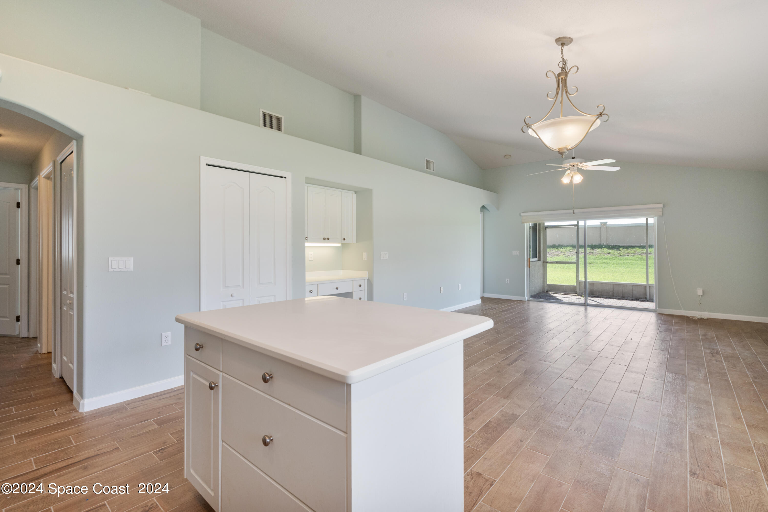 4220 Chardonnay Drive Rockledge, FL 32955 - Photo 17 of 51 a view of an empty room with window and wooden floor