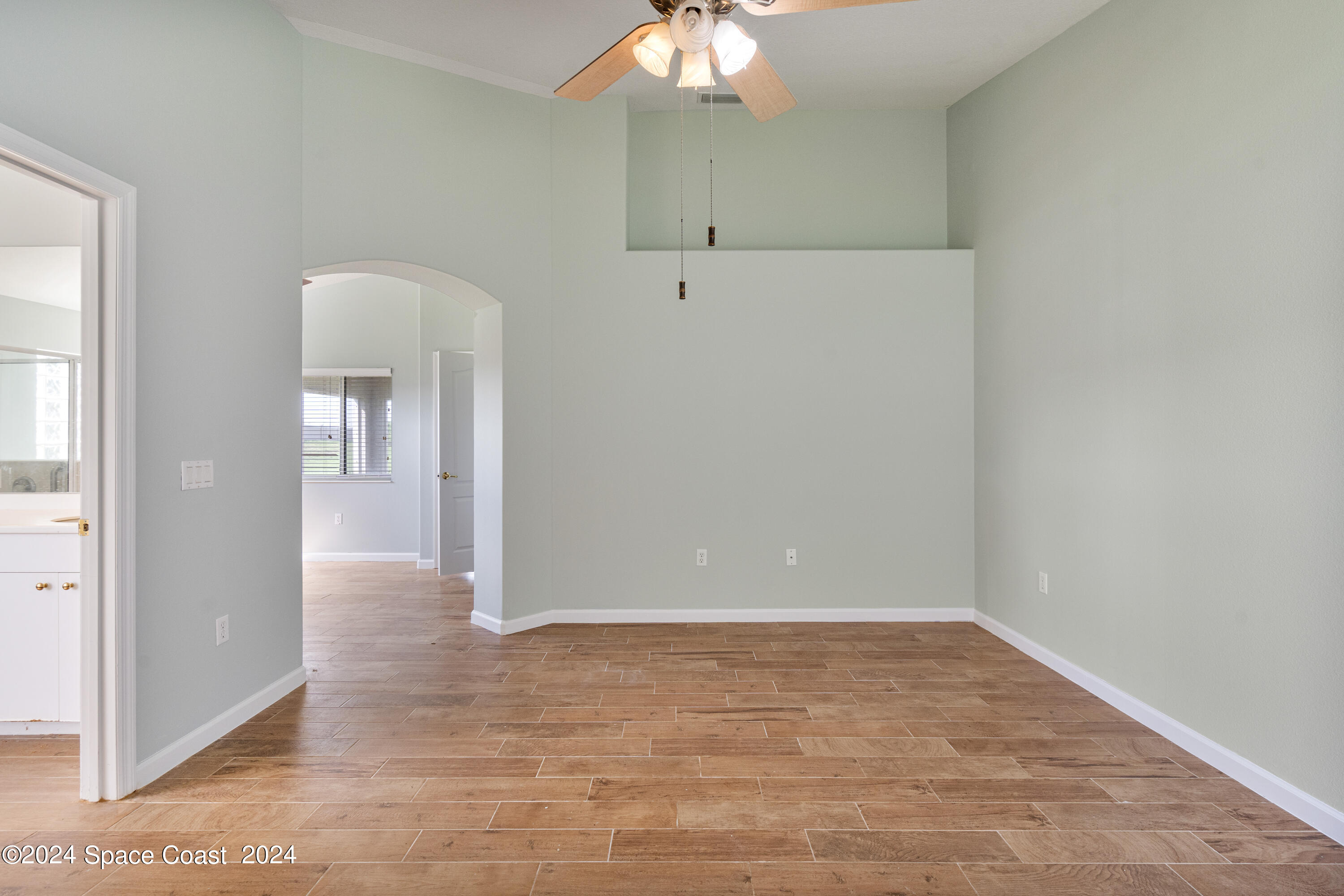 4220 Chardonnay Drive Rockledge, FL 32955 - Photo 31 of 51 wooden floor in an empty room