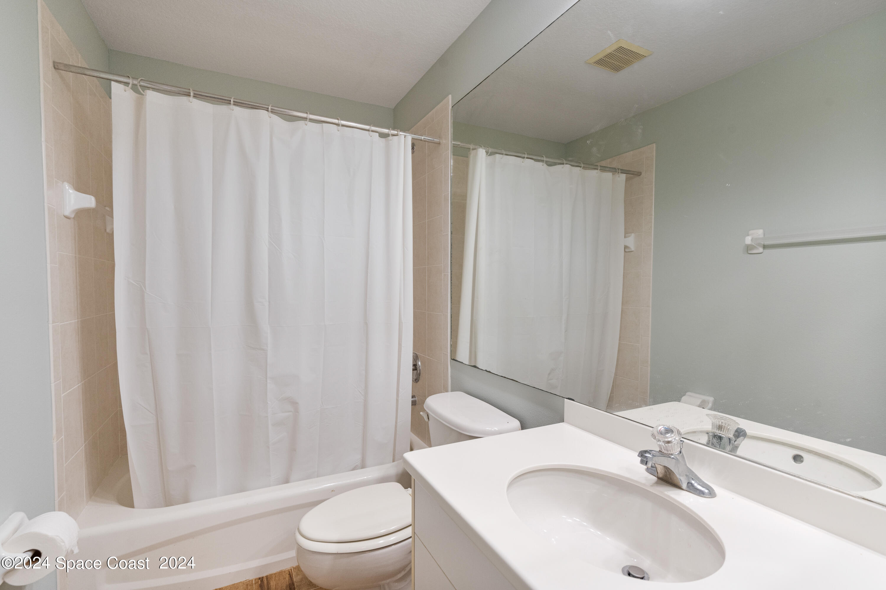 4220 Chardonnay Drive Rockledge, FL 32955 - Photo 37 of 51 a bathroom with a sink toilet and shower
