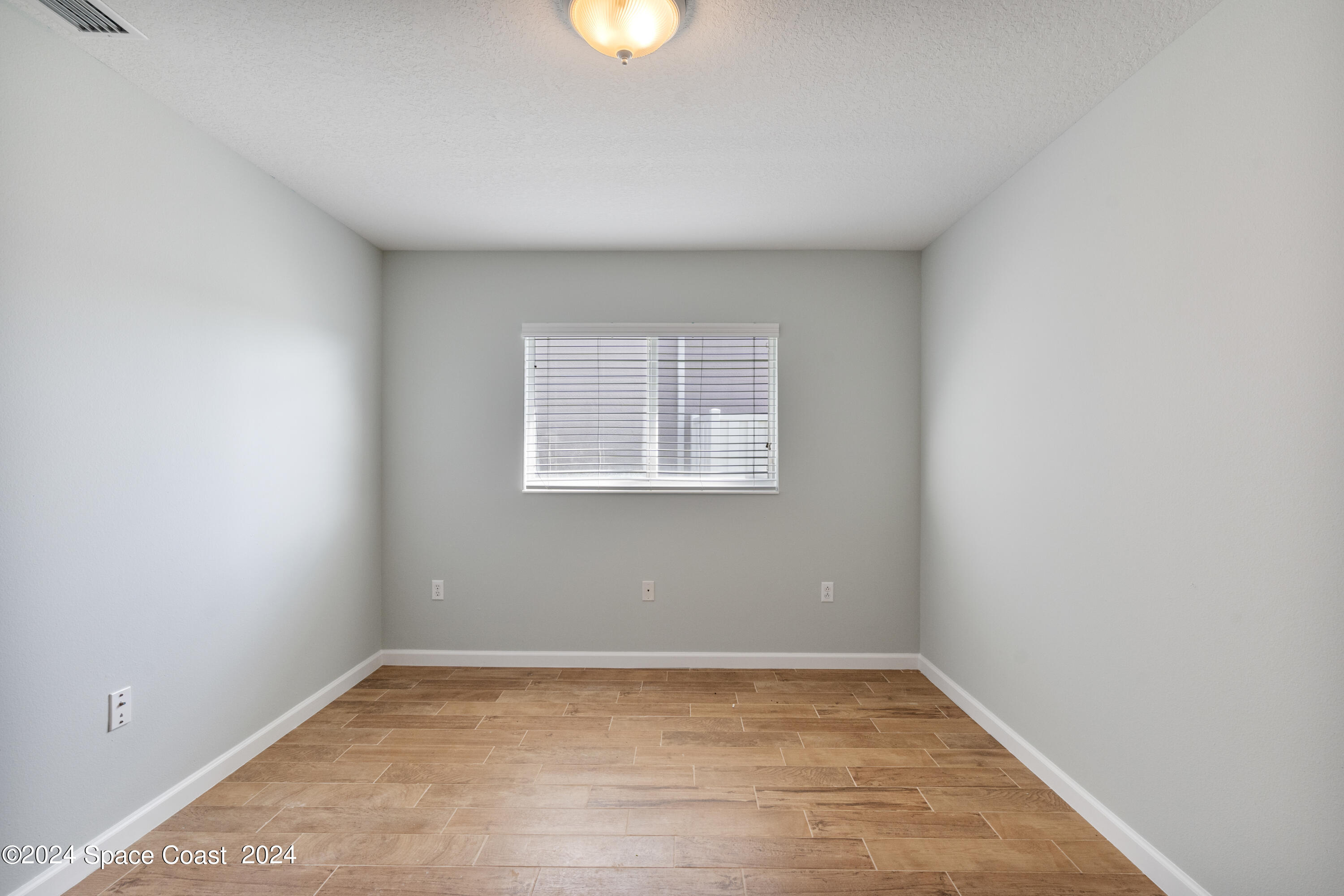4220 Chardonnay Drive Rockledge, FL 32955 - Photo 40 of 51 a view of an empty room with a window