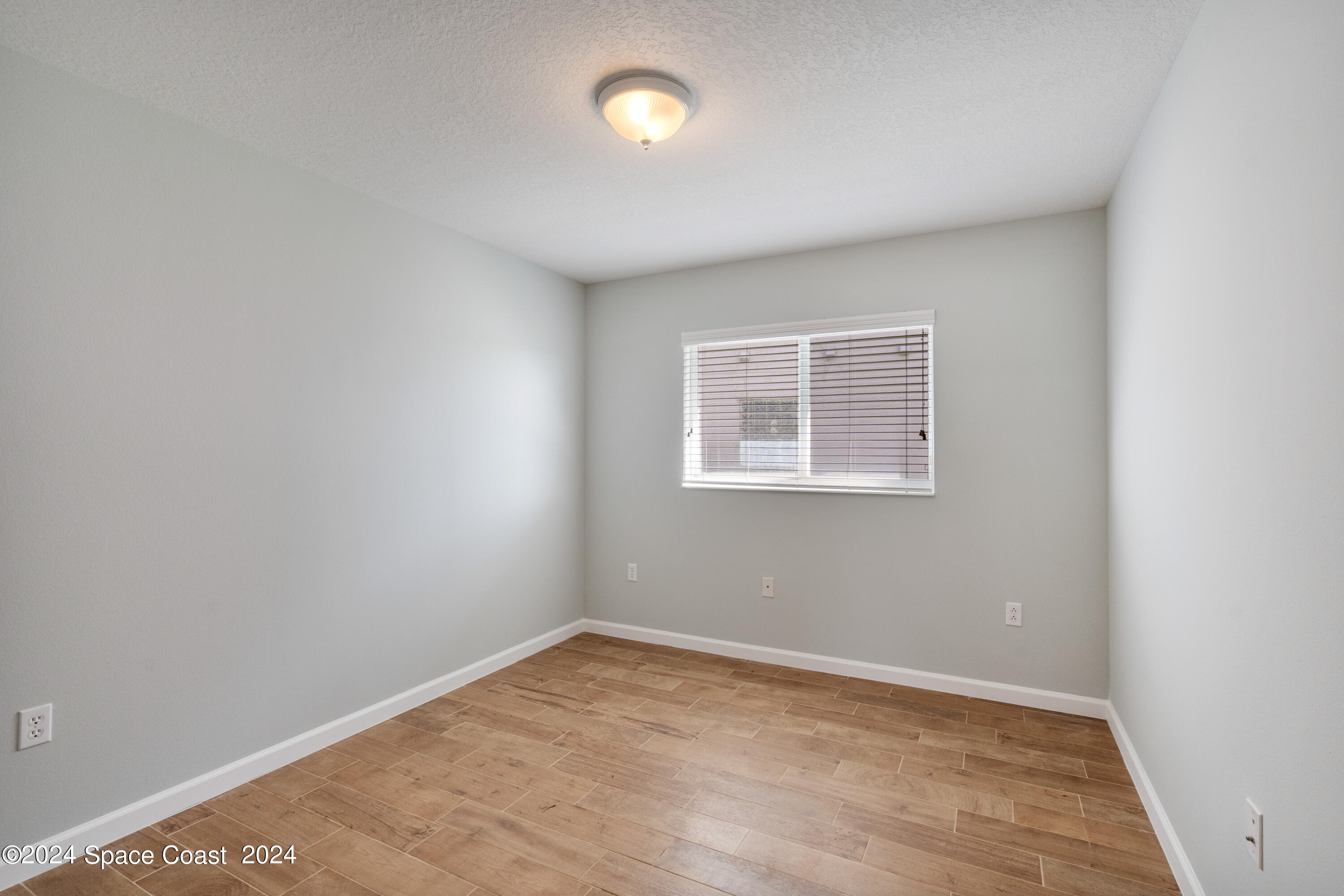4220 Chardonnay Drive Rockledge, FL 32955 - Photo 41 of 51 an empty room with a workspace